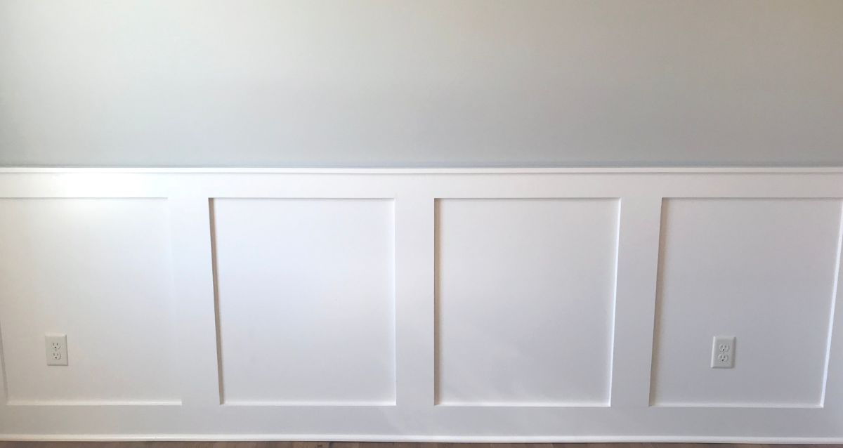 A white wall with white doors.