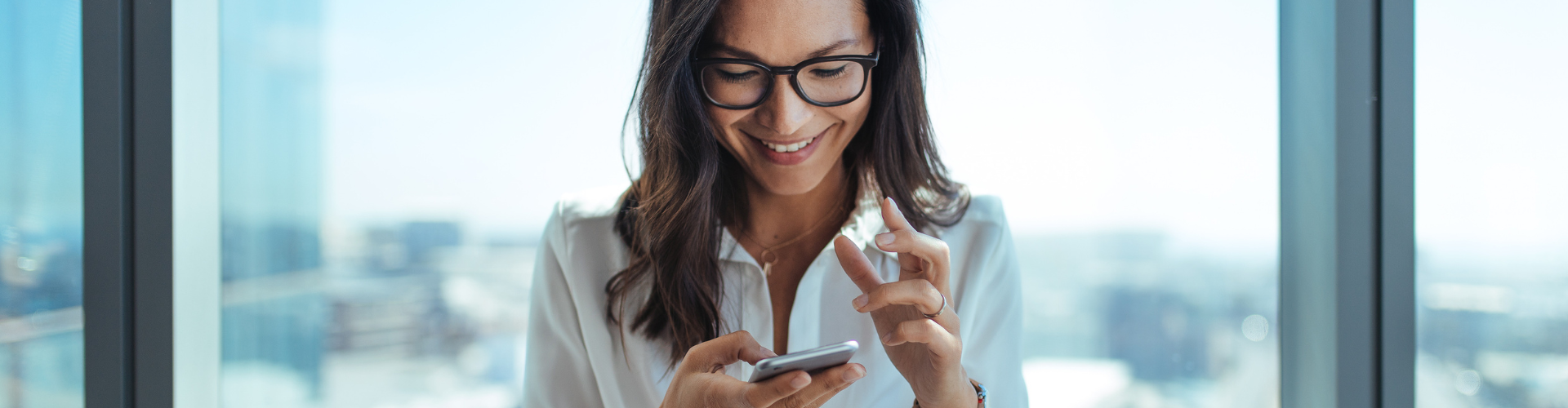 A woman holding a phone.