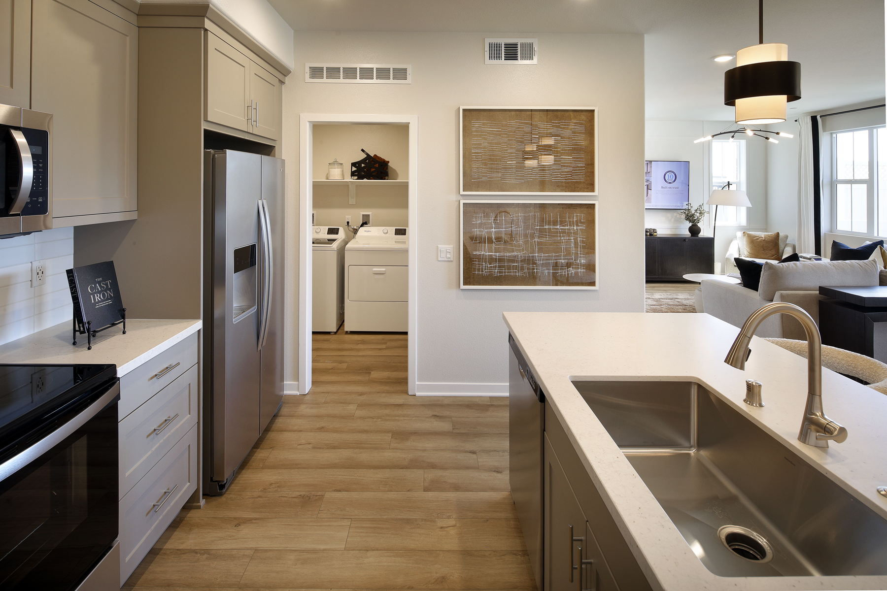 A kitchen with white cabinets.