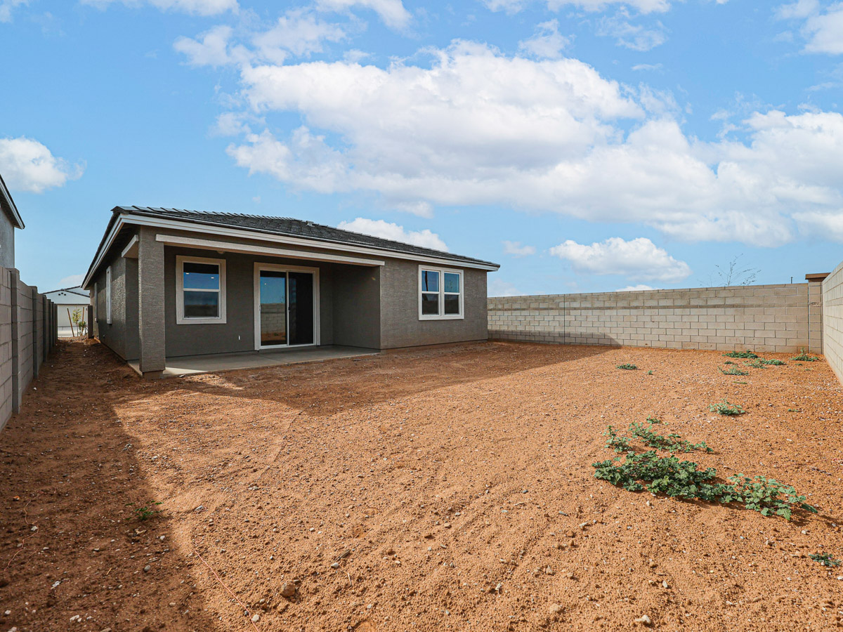 A house with a dirt yard.