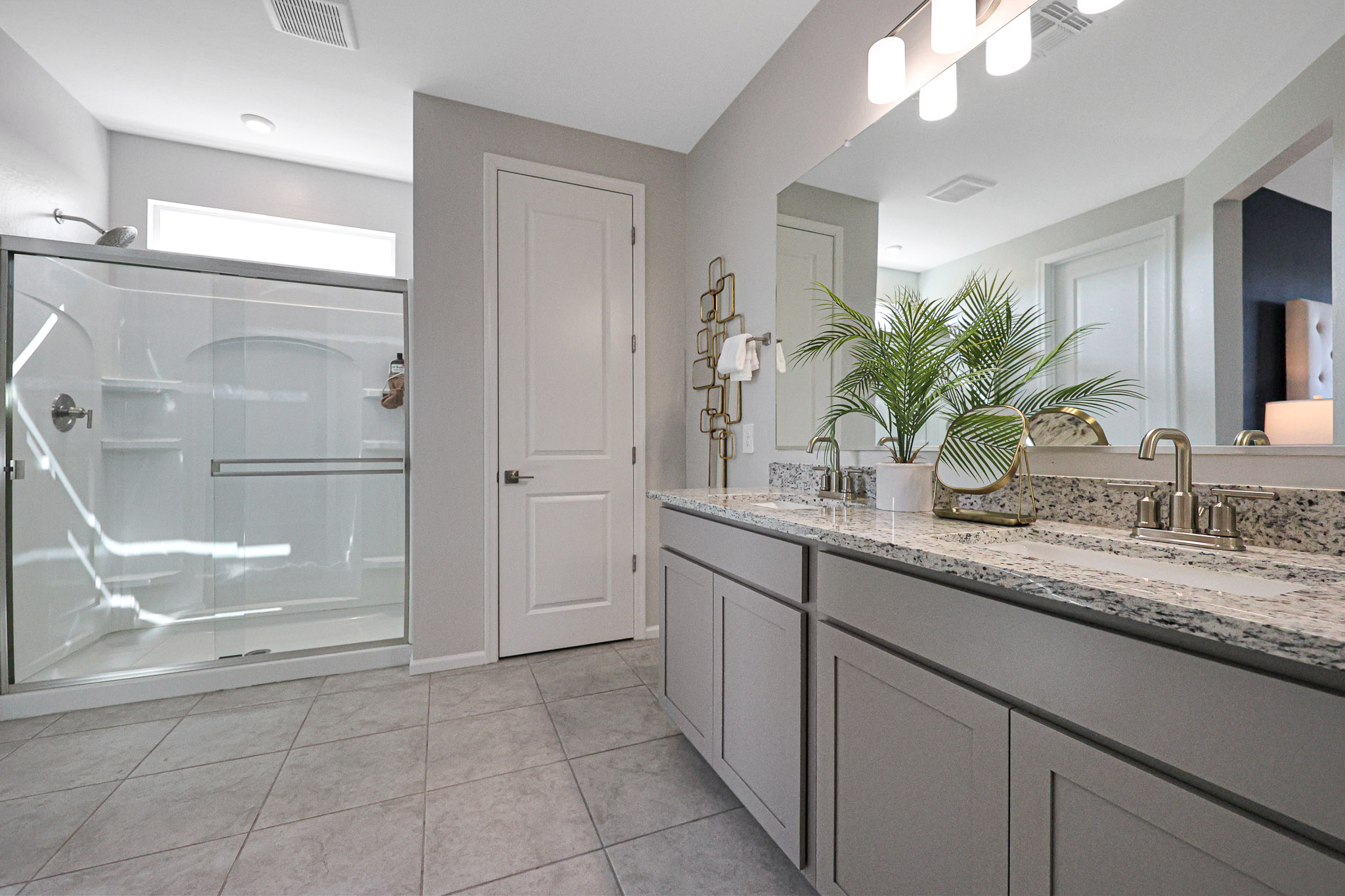 A bathroom with a marble countertop.