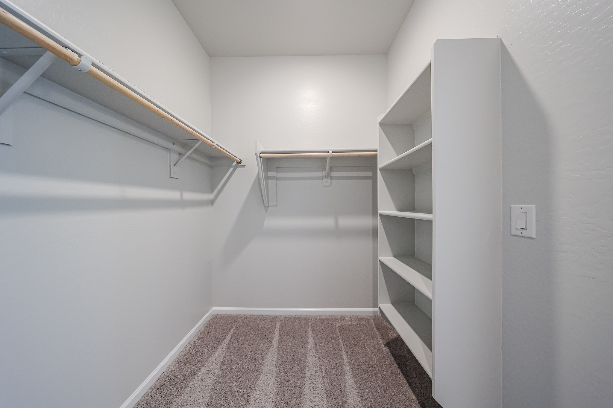 A hallway with white walls.