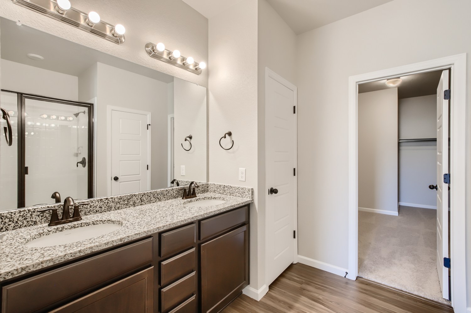 A bathroom with a large marble countertop.