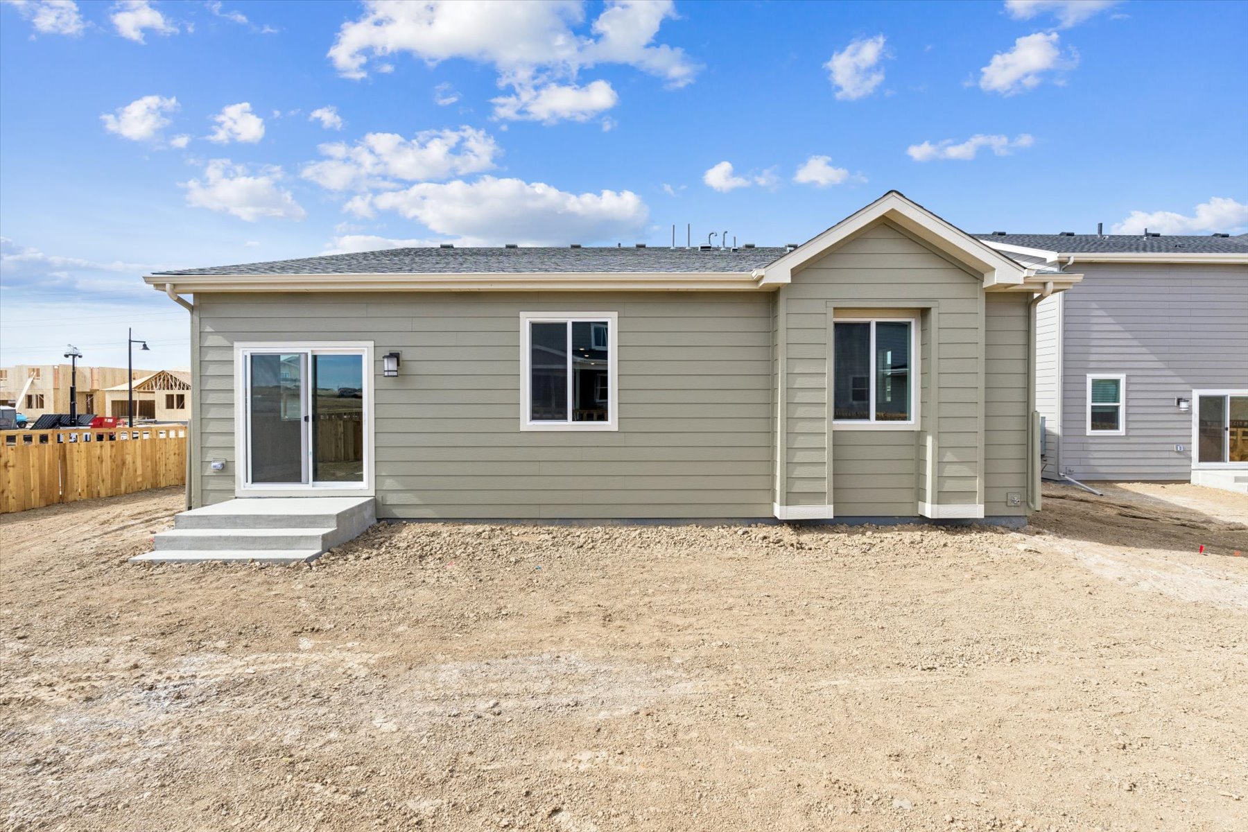 A house with a dirt yard.
