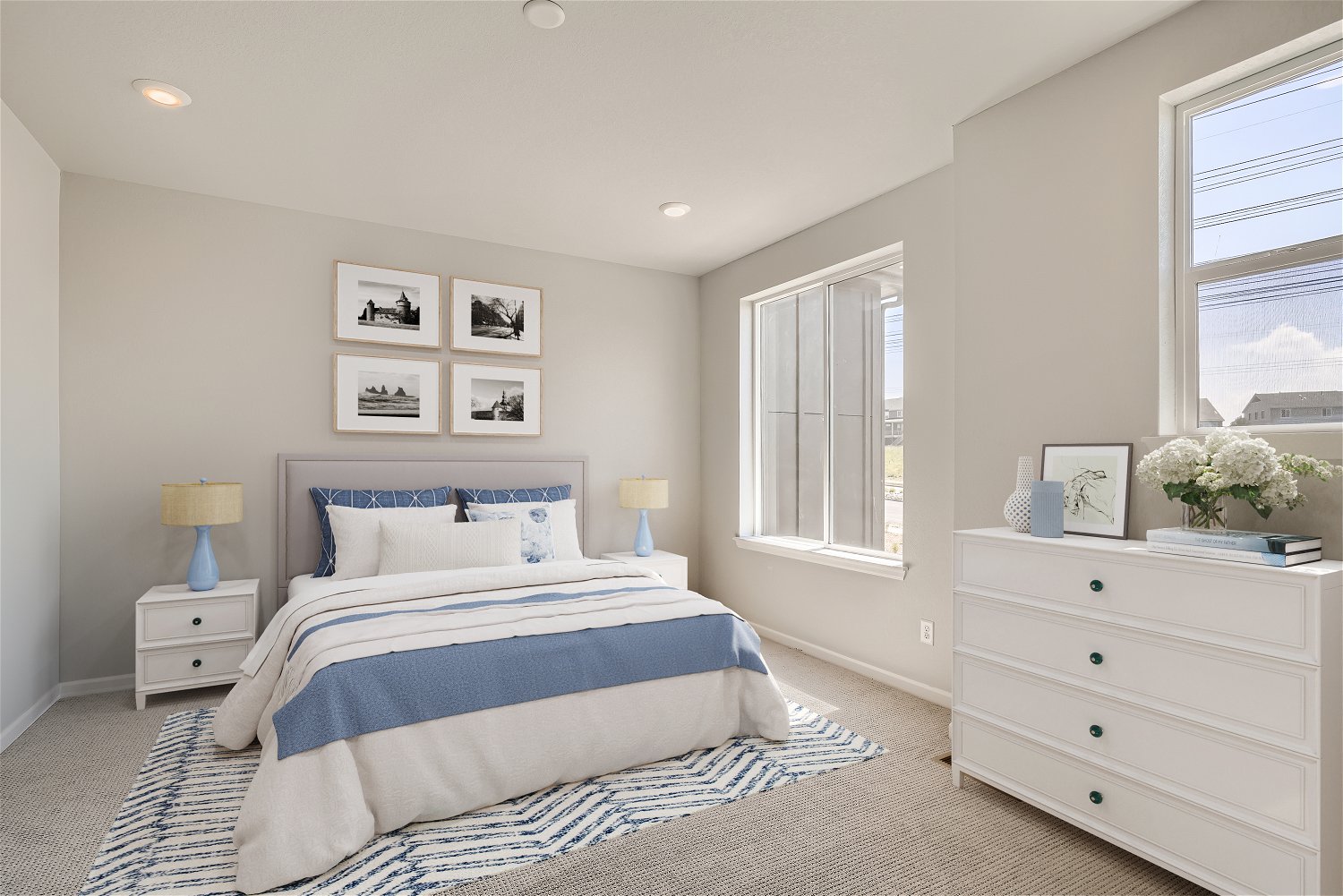 A bedroom with a bed and a dresser.