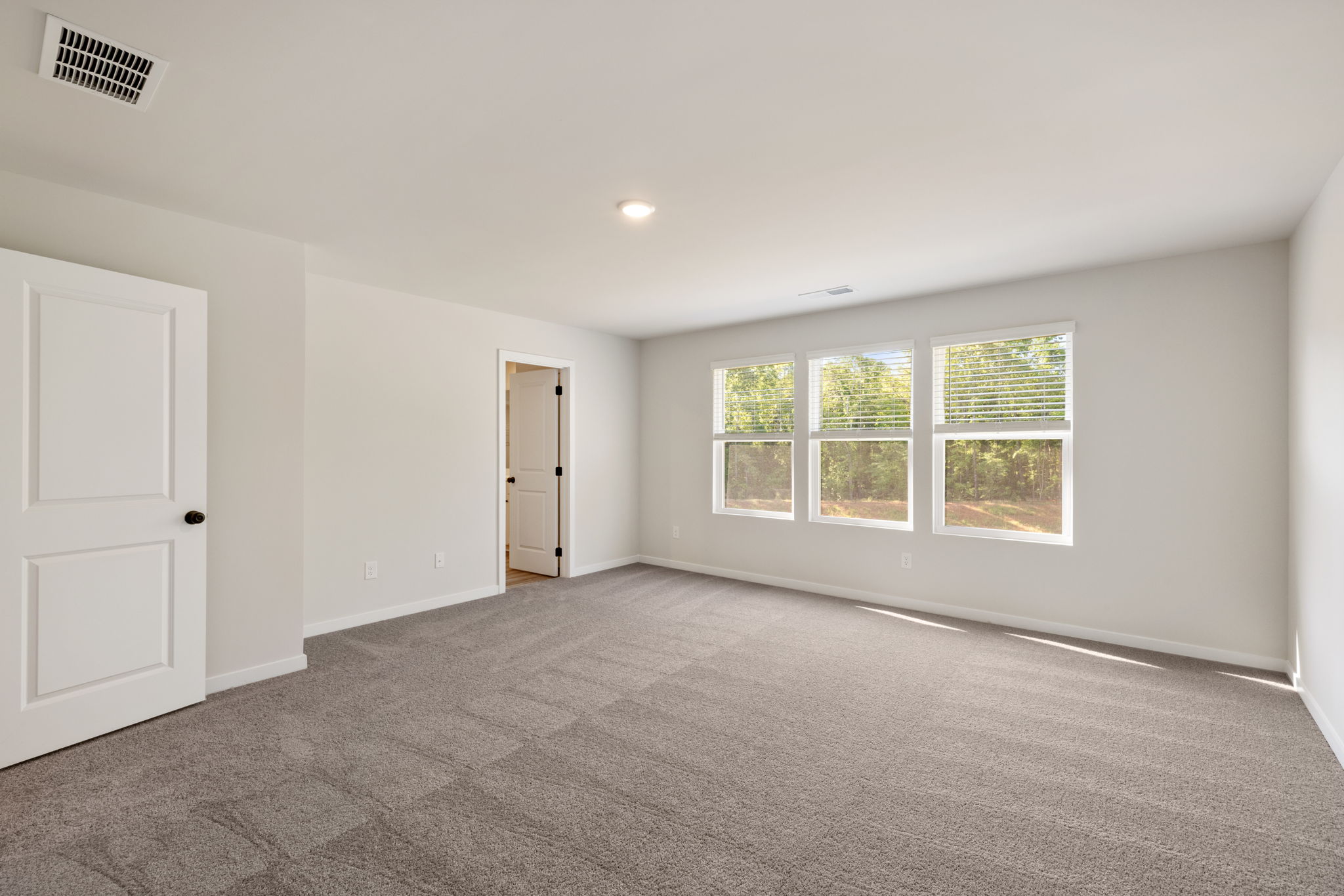 A room with a door and windows.