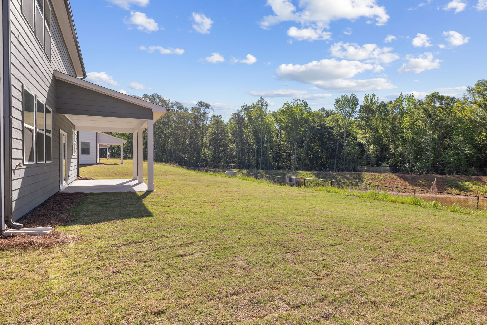 A house with a grass yard.