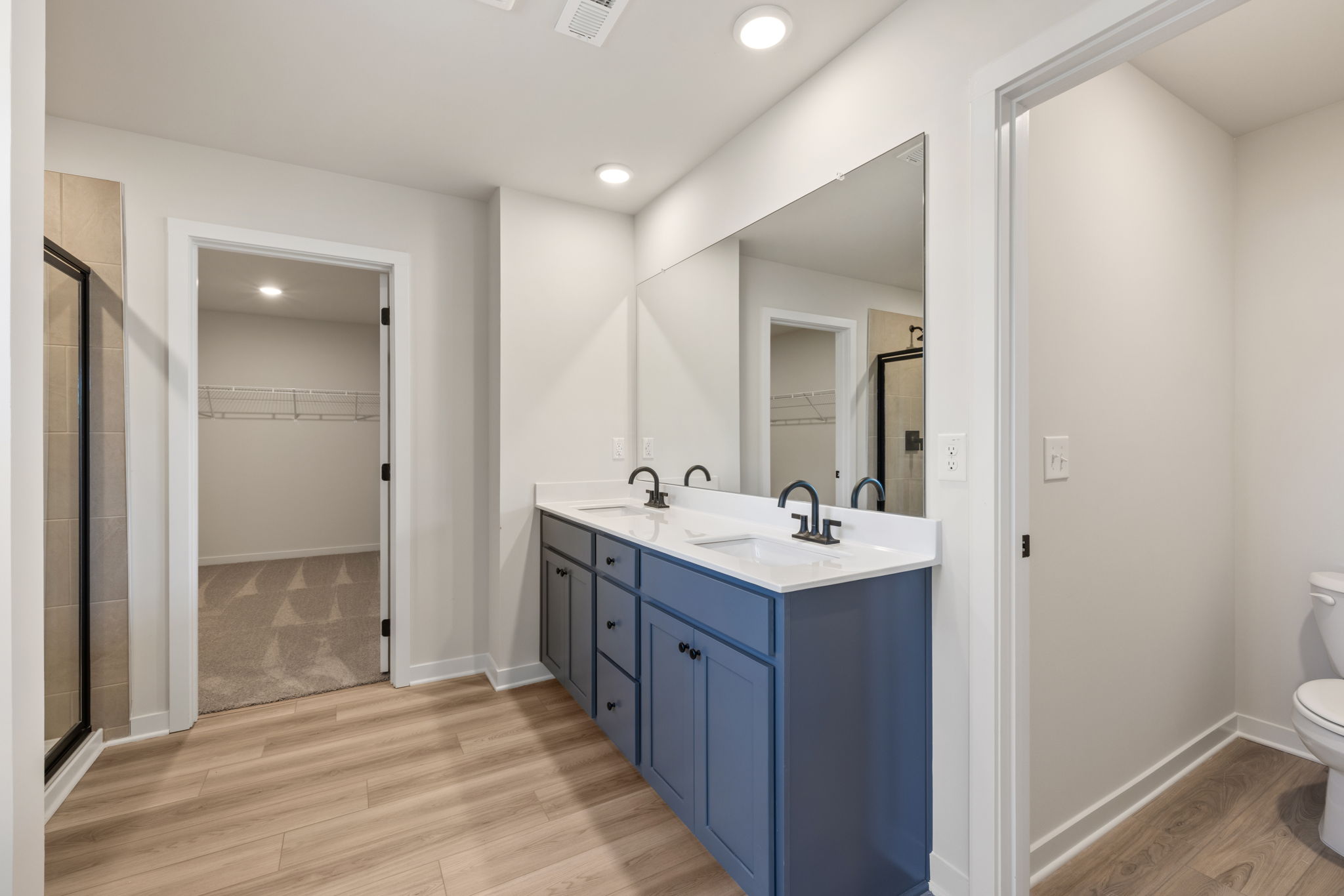 A bathroom with a blue cabinet.