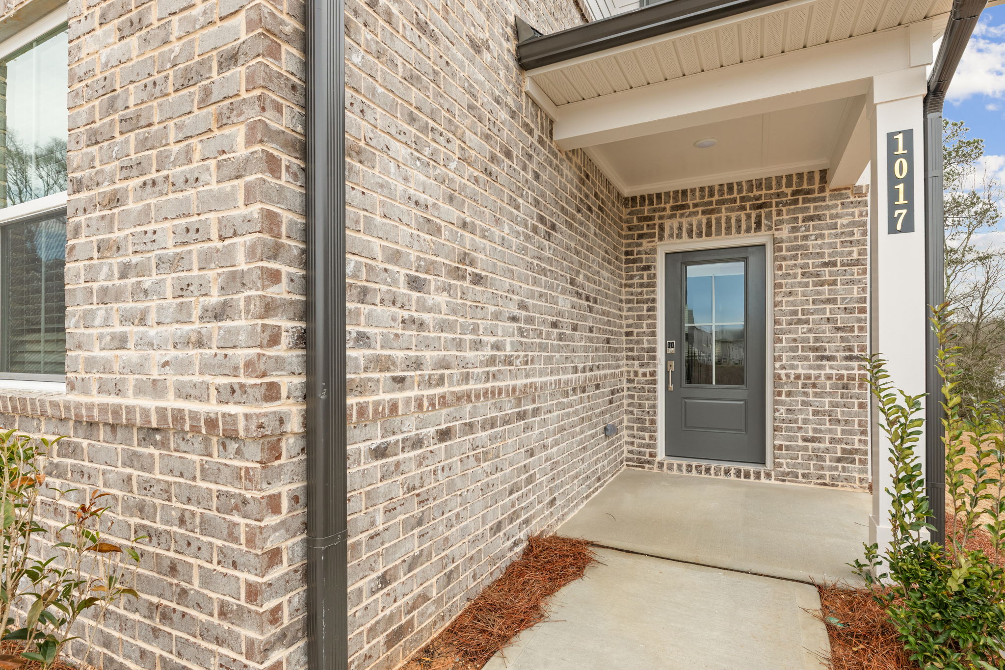 A brick building with a door.
