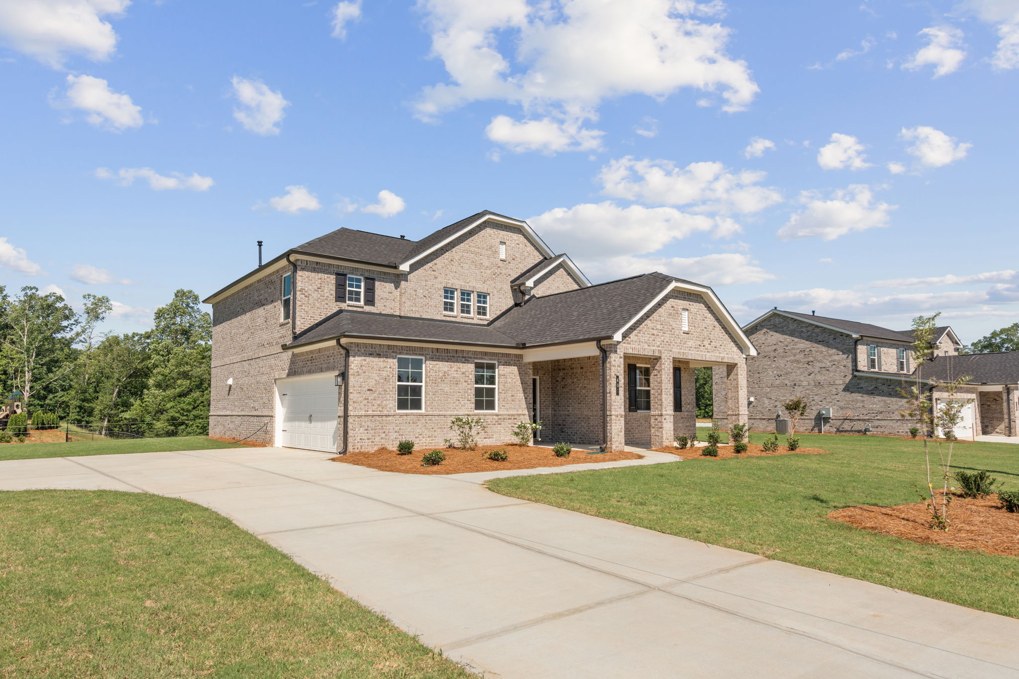 A large house with a driveway.