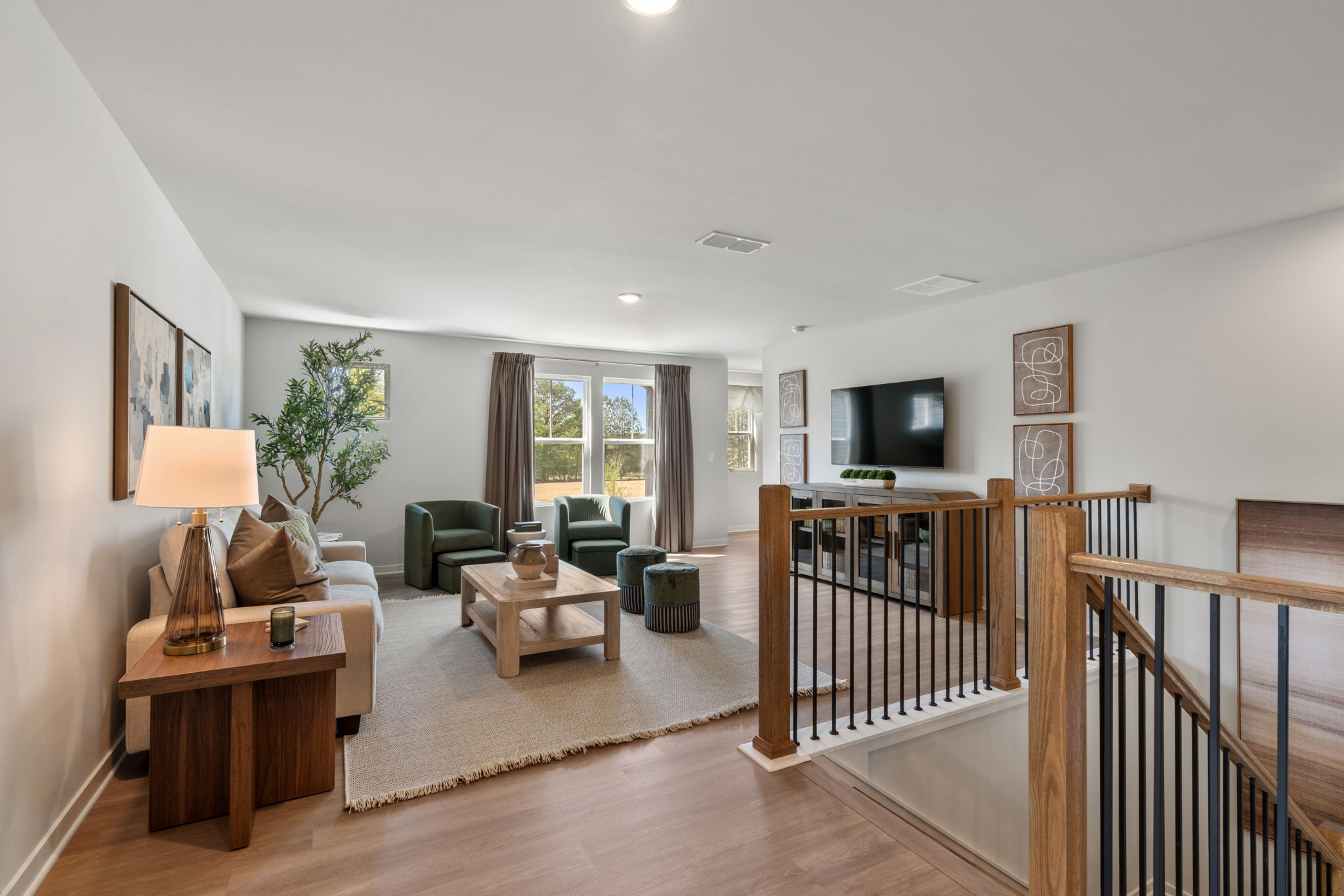 A living room with a wood floor.