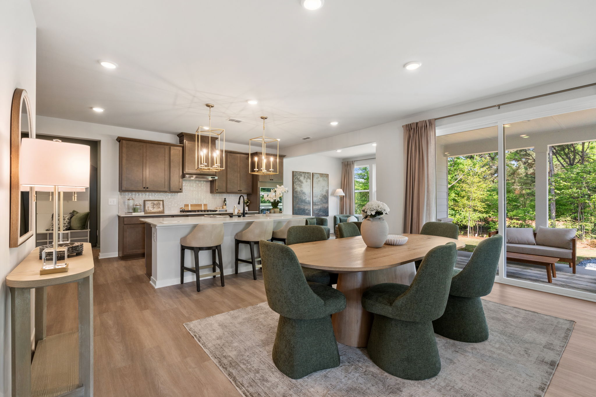 A large kitchen with a dining table.