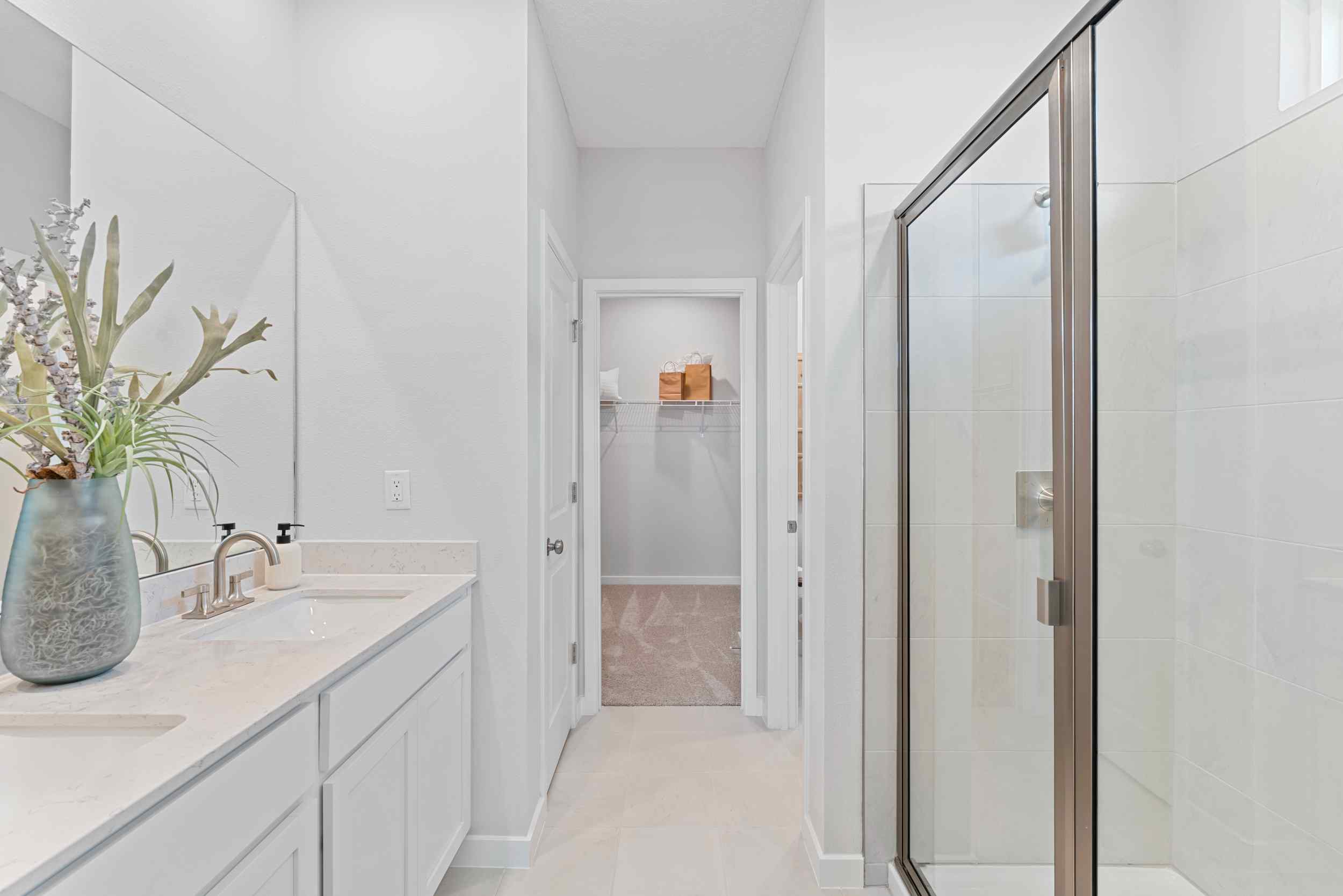 Laurel II Model Home Primary Bath with Dual Vanity Sink and Super Shower at Camden Woods in Kingsland, GA