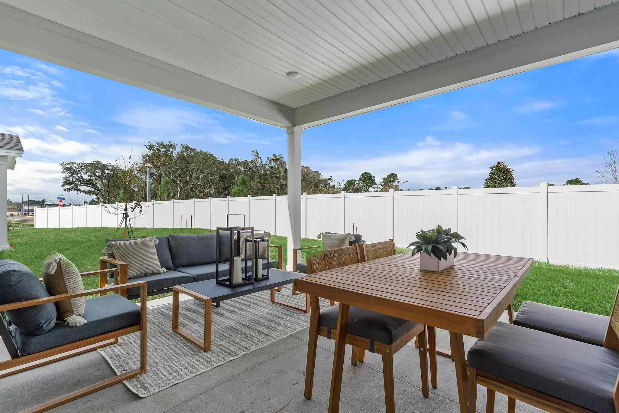 A table and chairs on a deck.