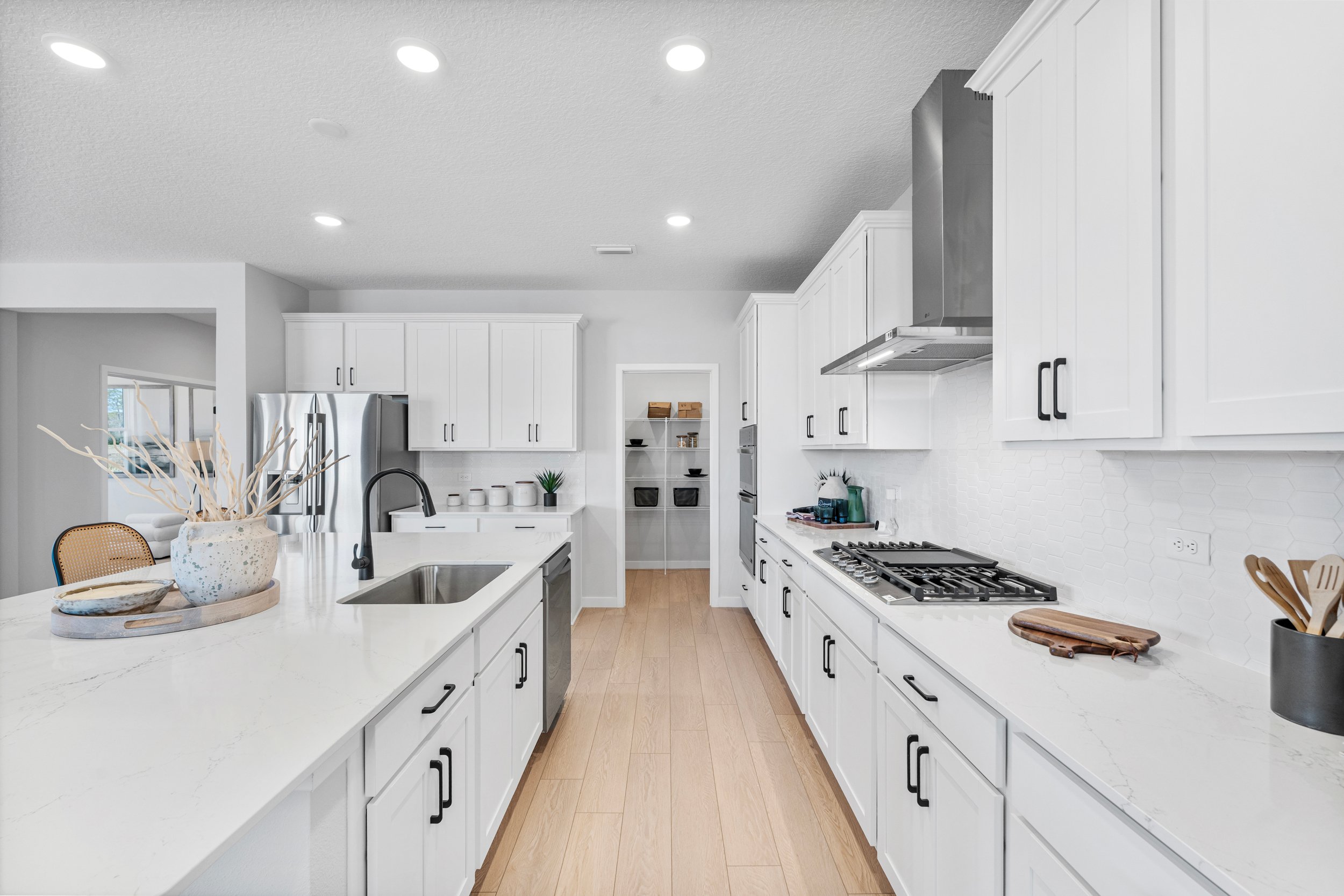 Kenai Model Home Chef's Kitchen with Walk-In Pantry at Reserve East