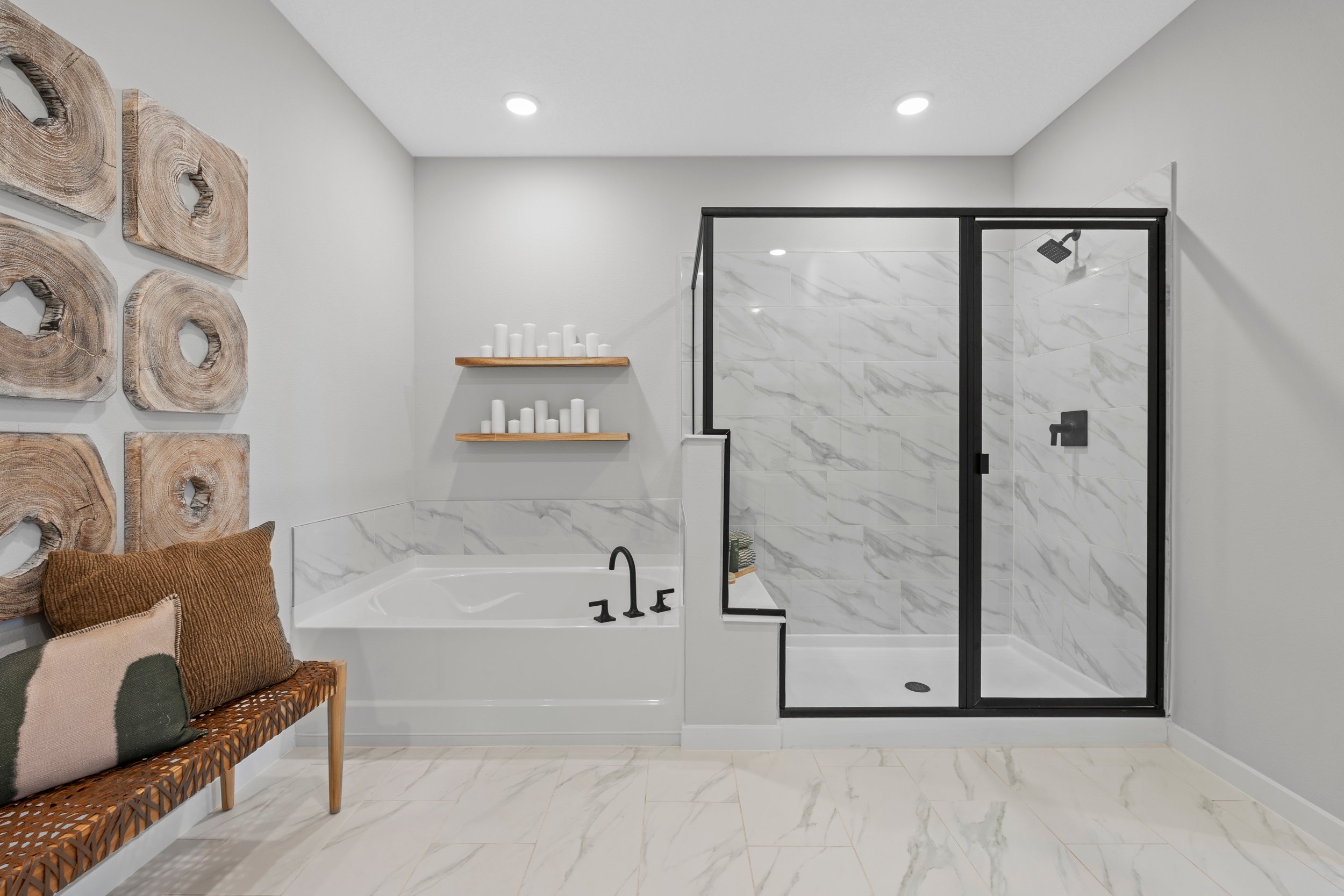 A bathroom with a large mirror.