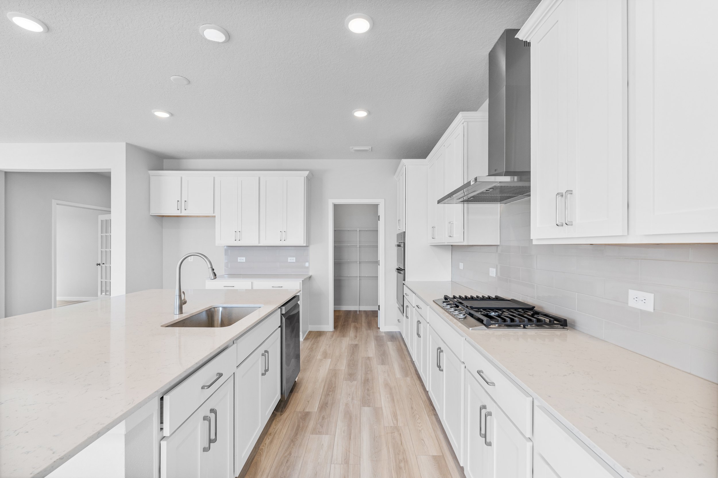 Lot 46 Chef's Kitchen with Walk-In Pantry at Reserve East