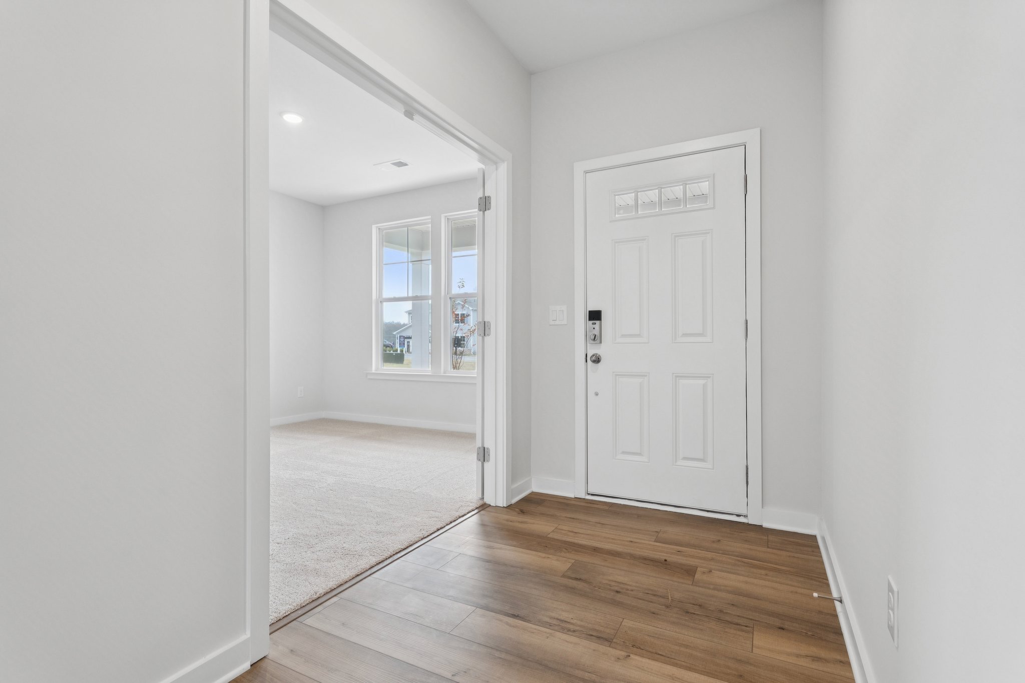 A hallway with white doors.