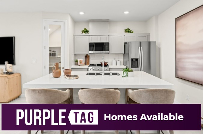 A kitchen with a white counter top.