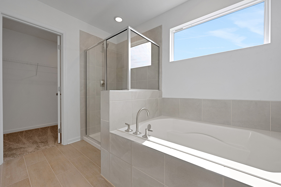 A bathroom with a glass shower.