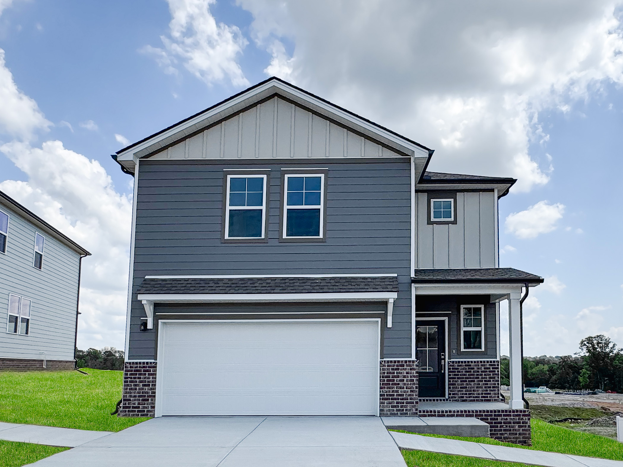 A small house with a garage.