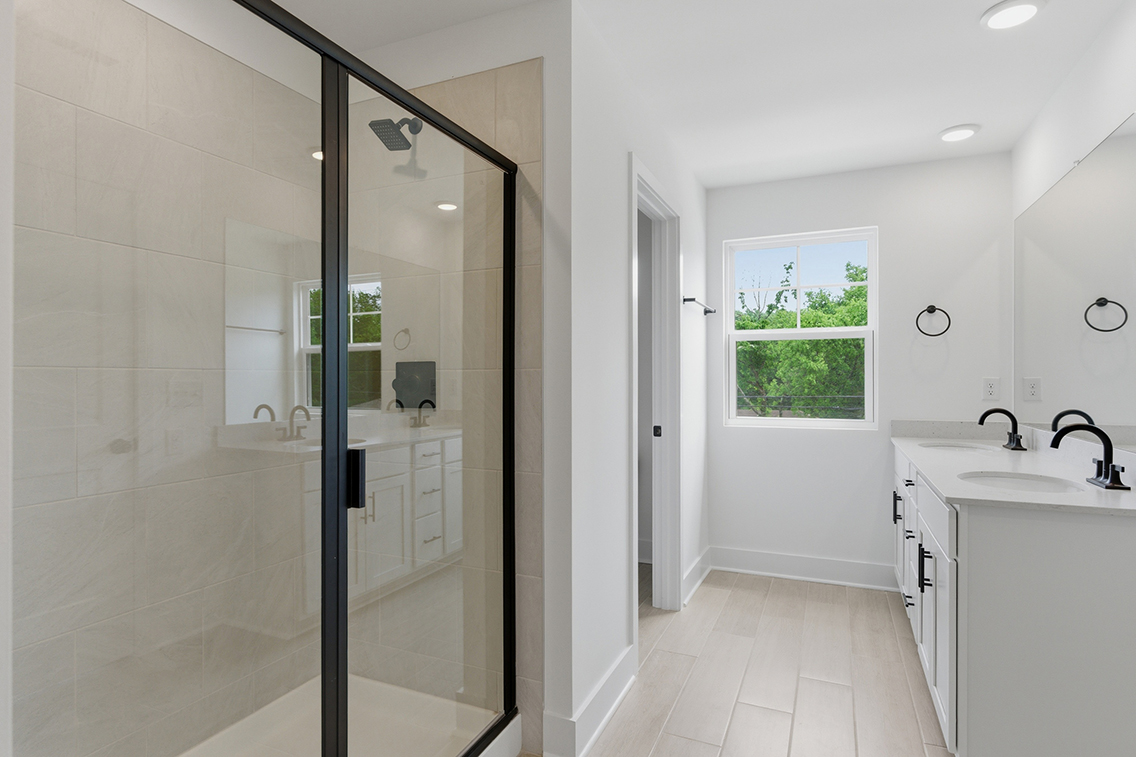 A bathroom with a glass shower.