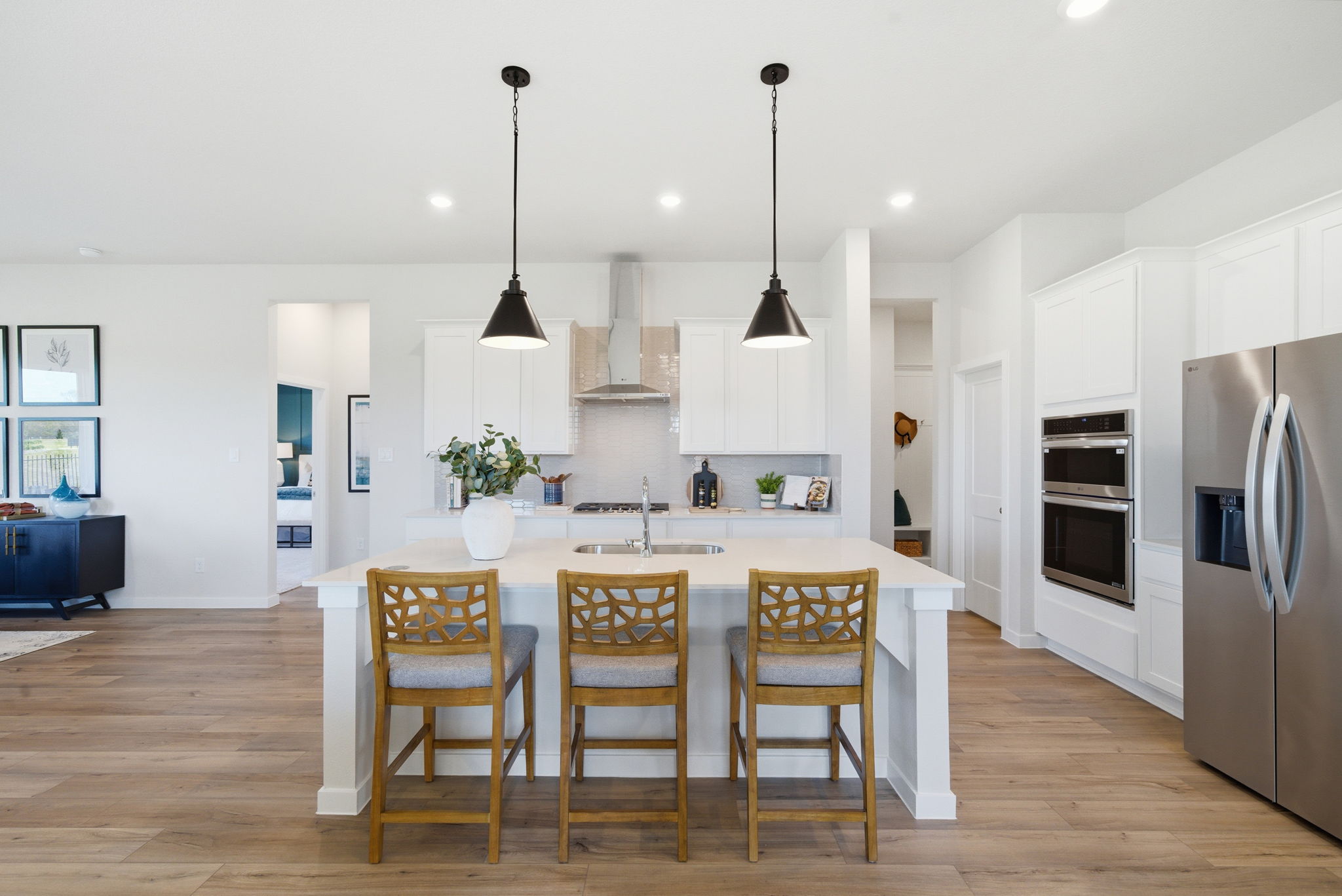 A kitchen with a dining table.