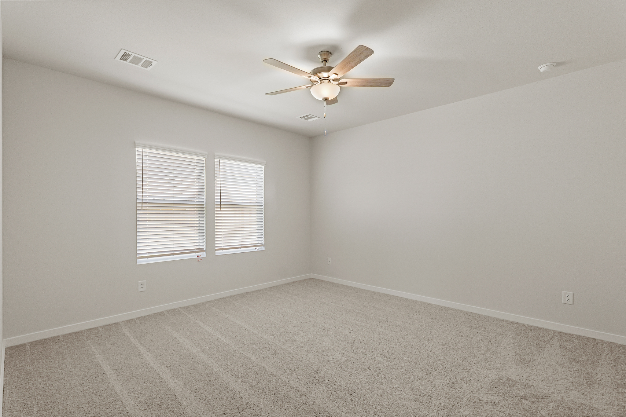 A ceiling fan in a room.