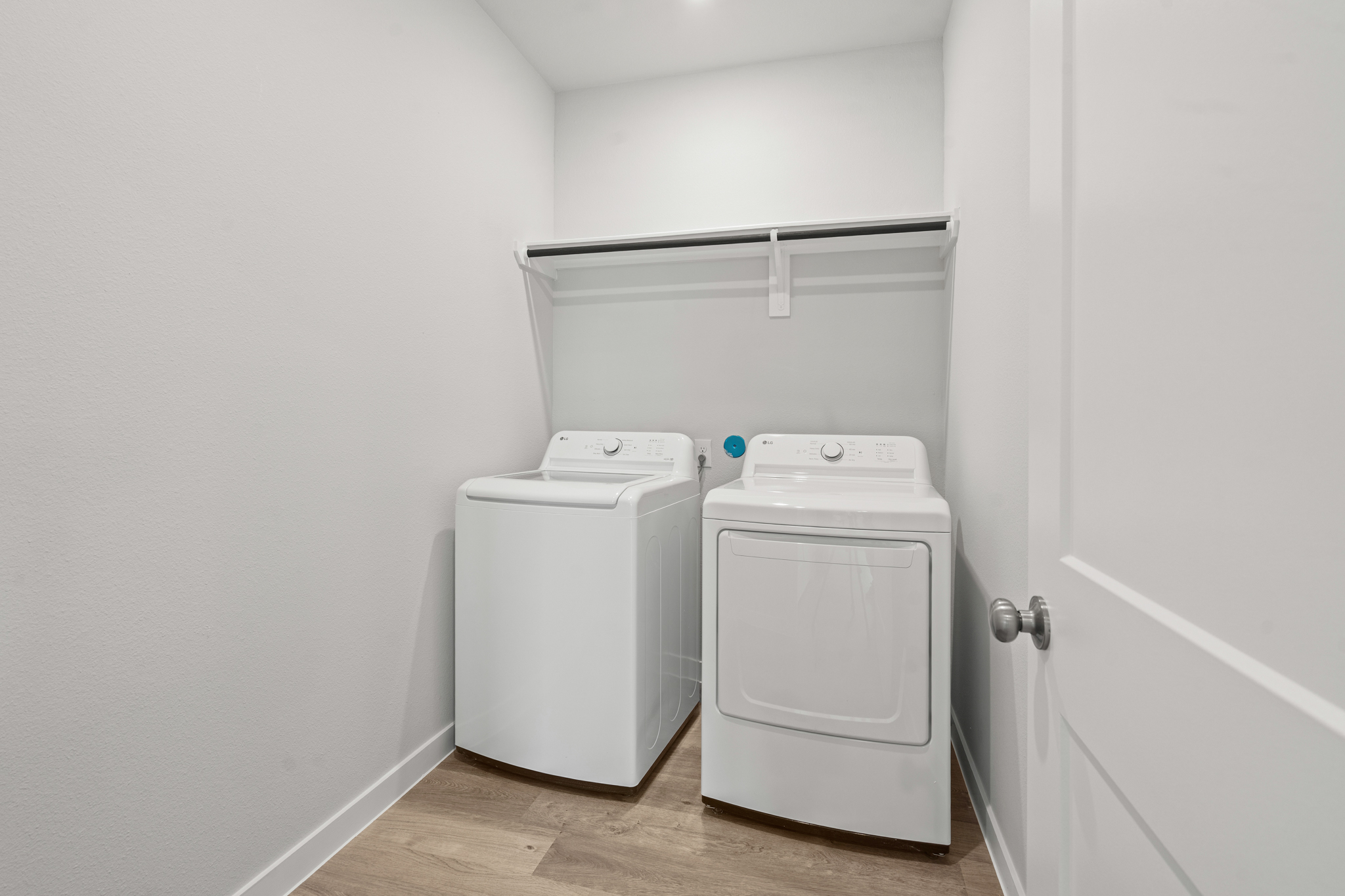 A white room with a white door and a white wall with a white door and a white door.