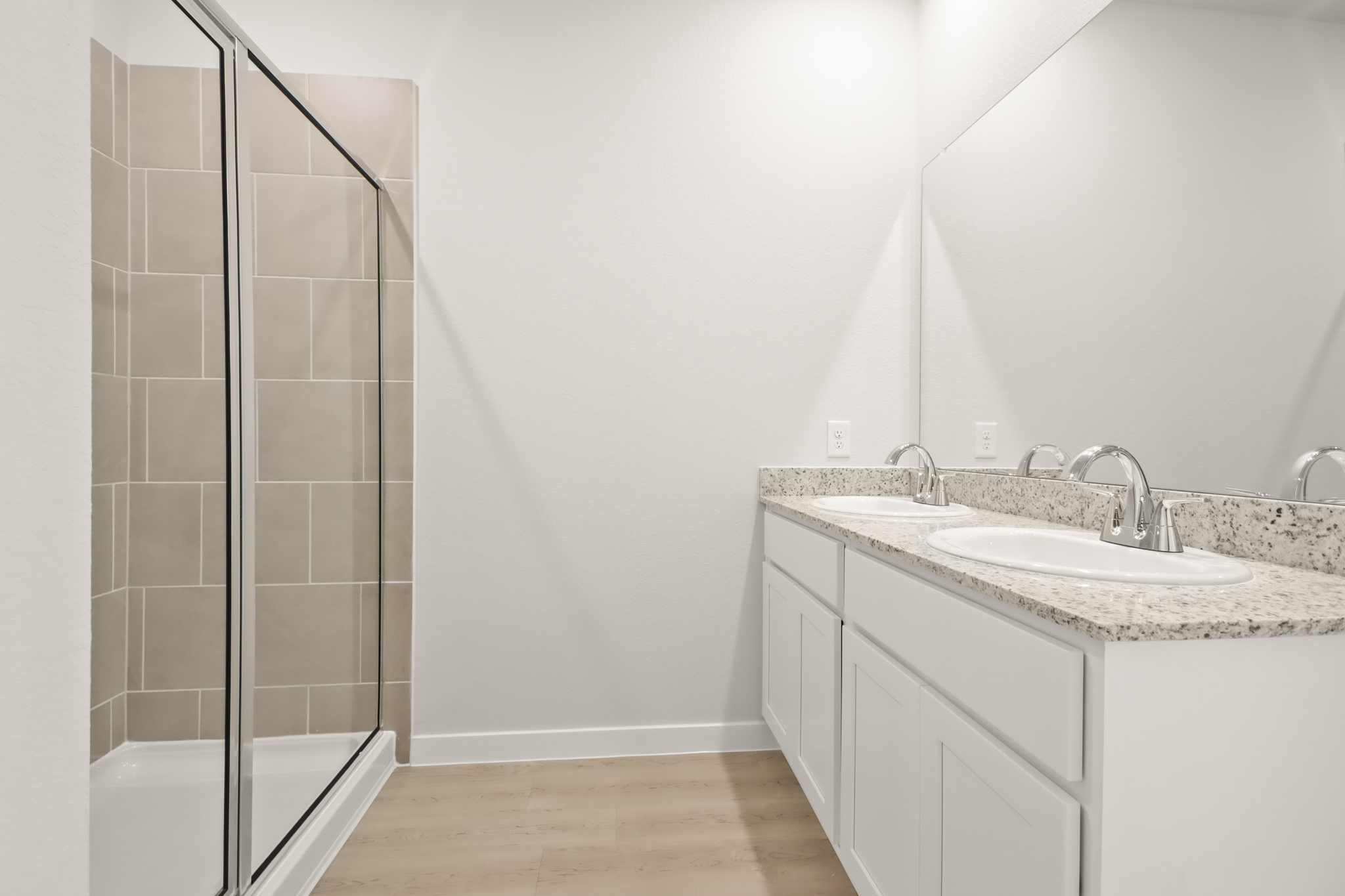 A bathroom with a glass shower.