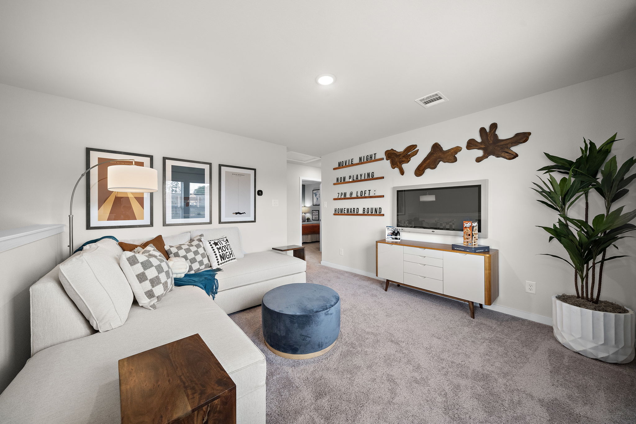 A living room with a tv and couches.
