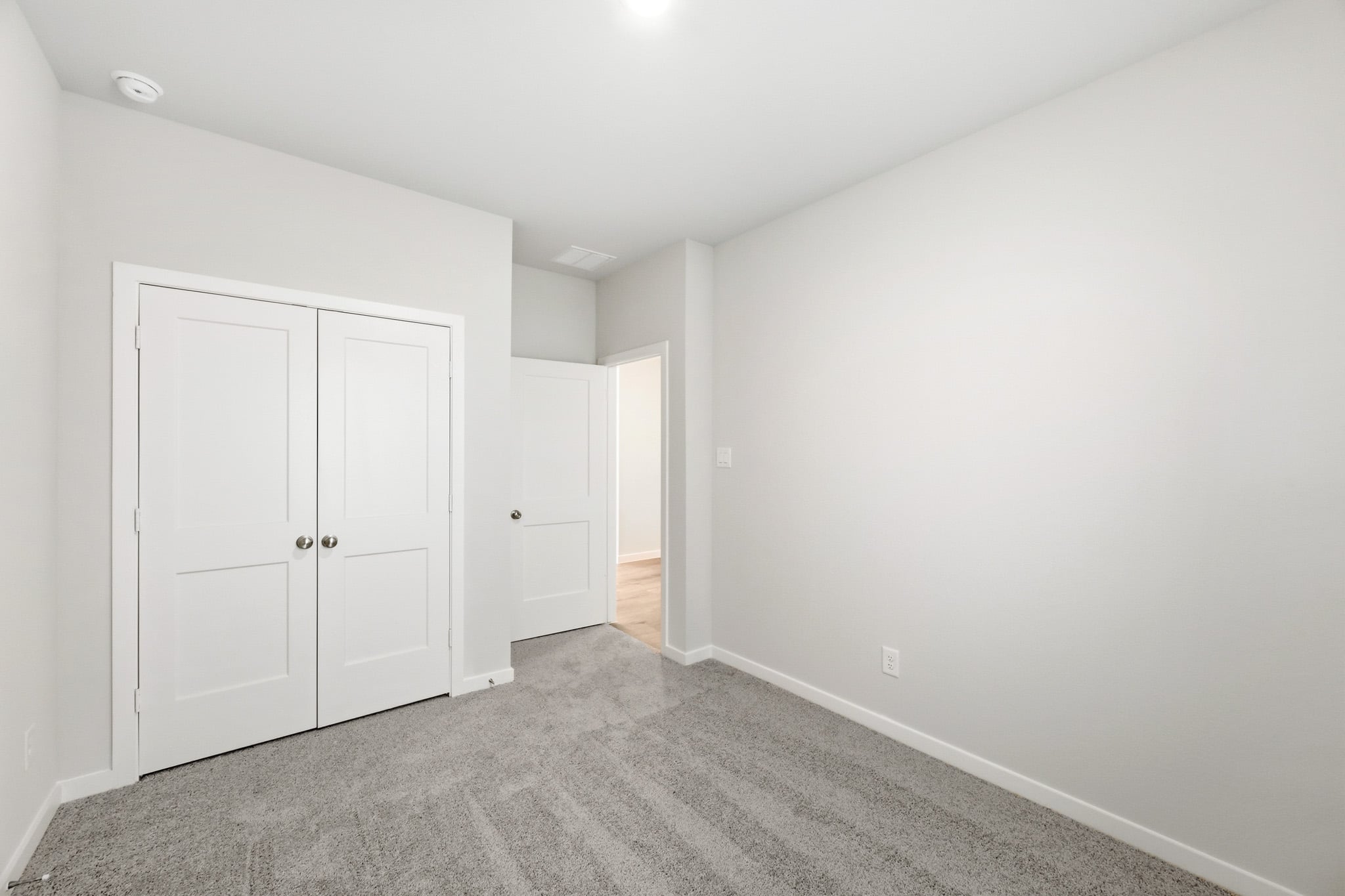 A room with white doors.