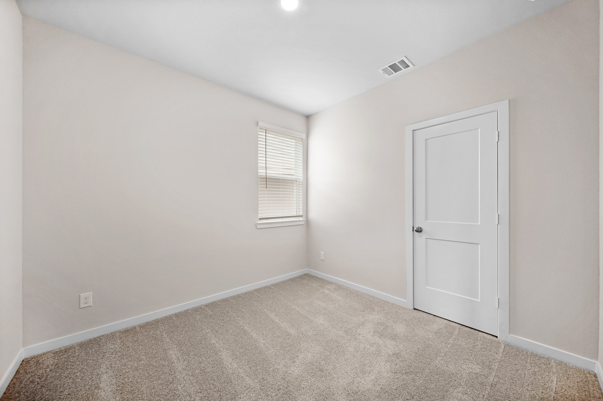 A room with a door and a window.