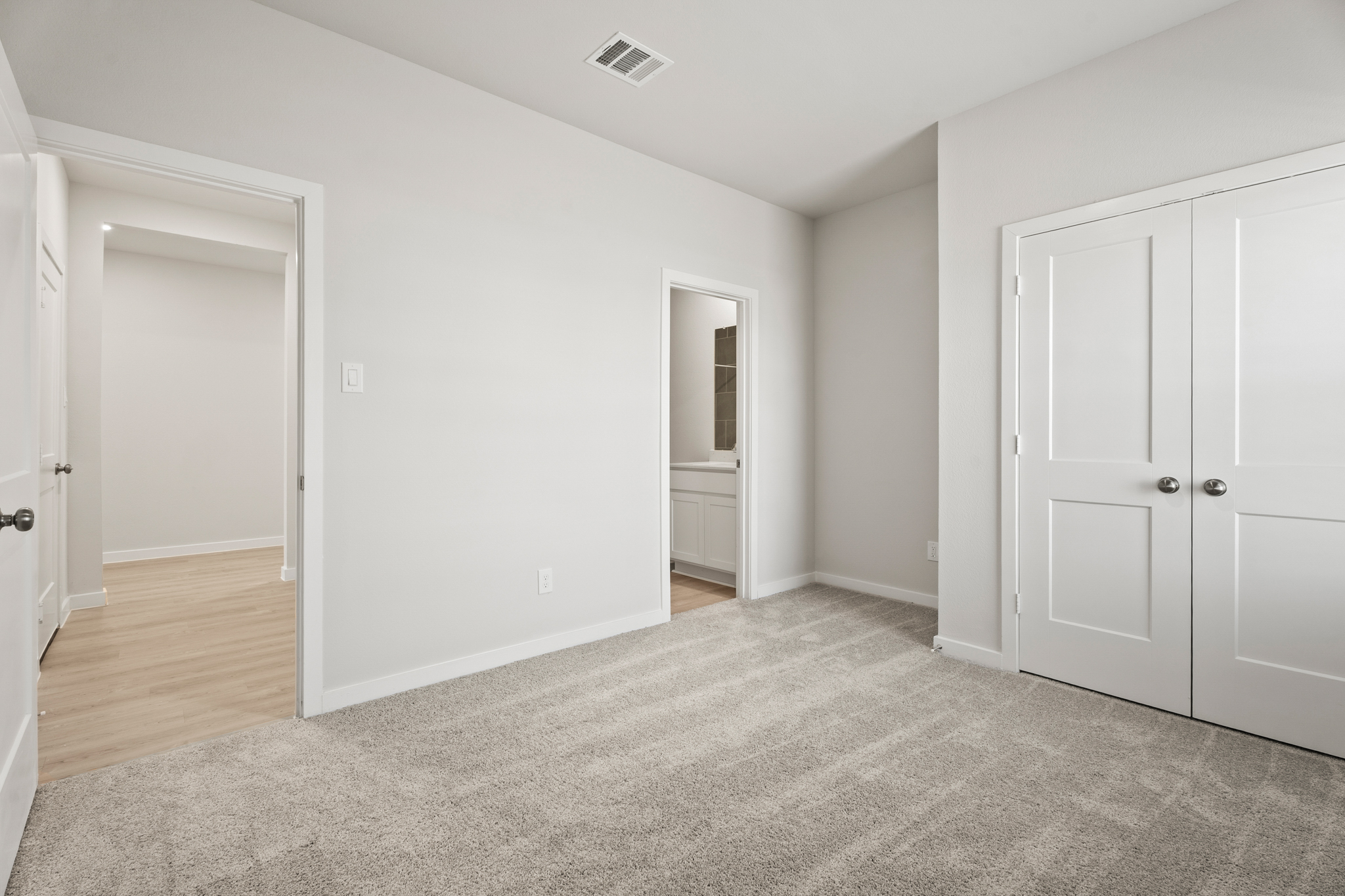 A room with white doors.