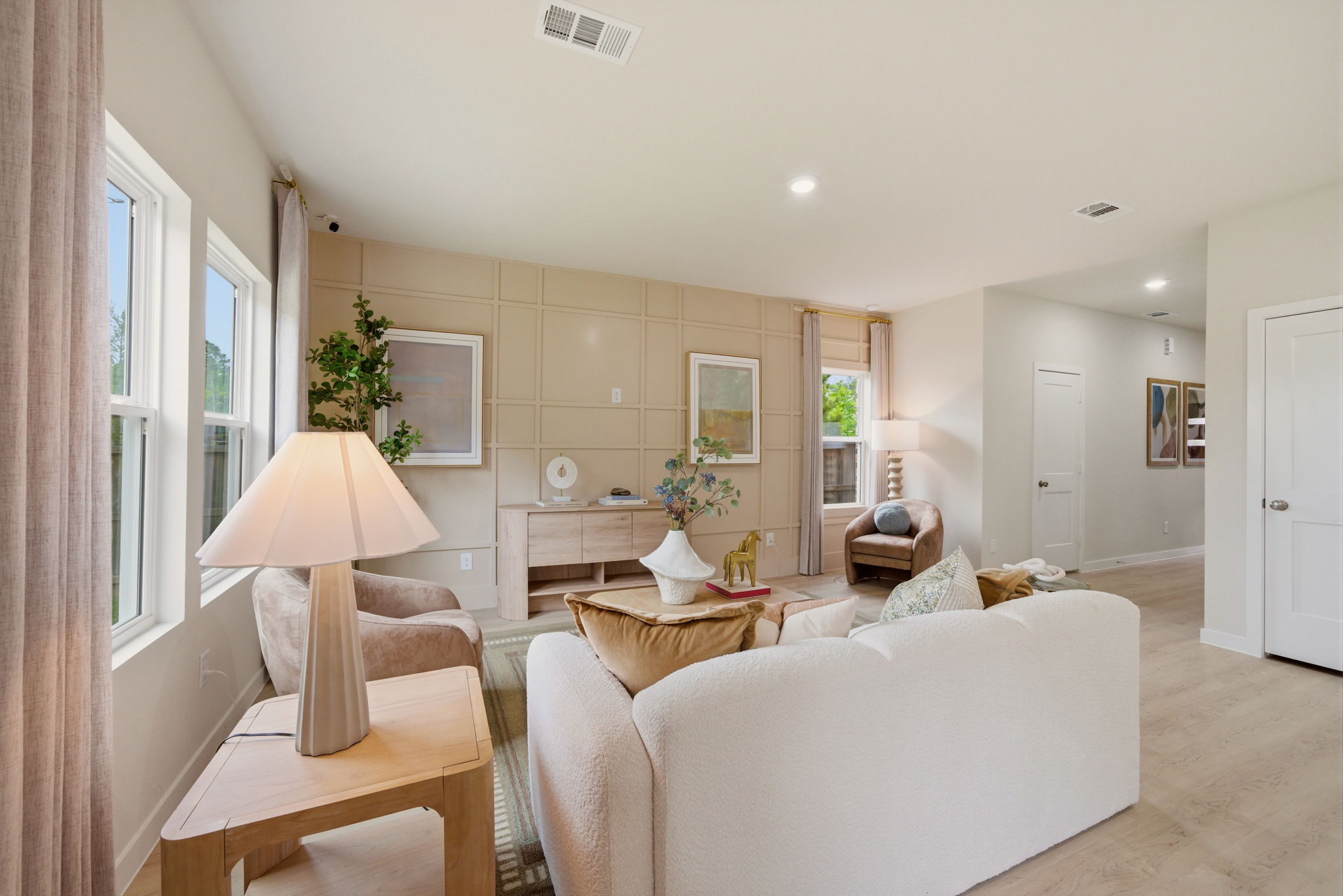 A living room with a couch and a table.