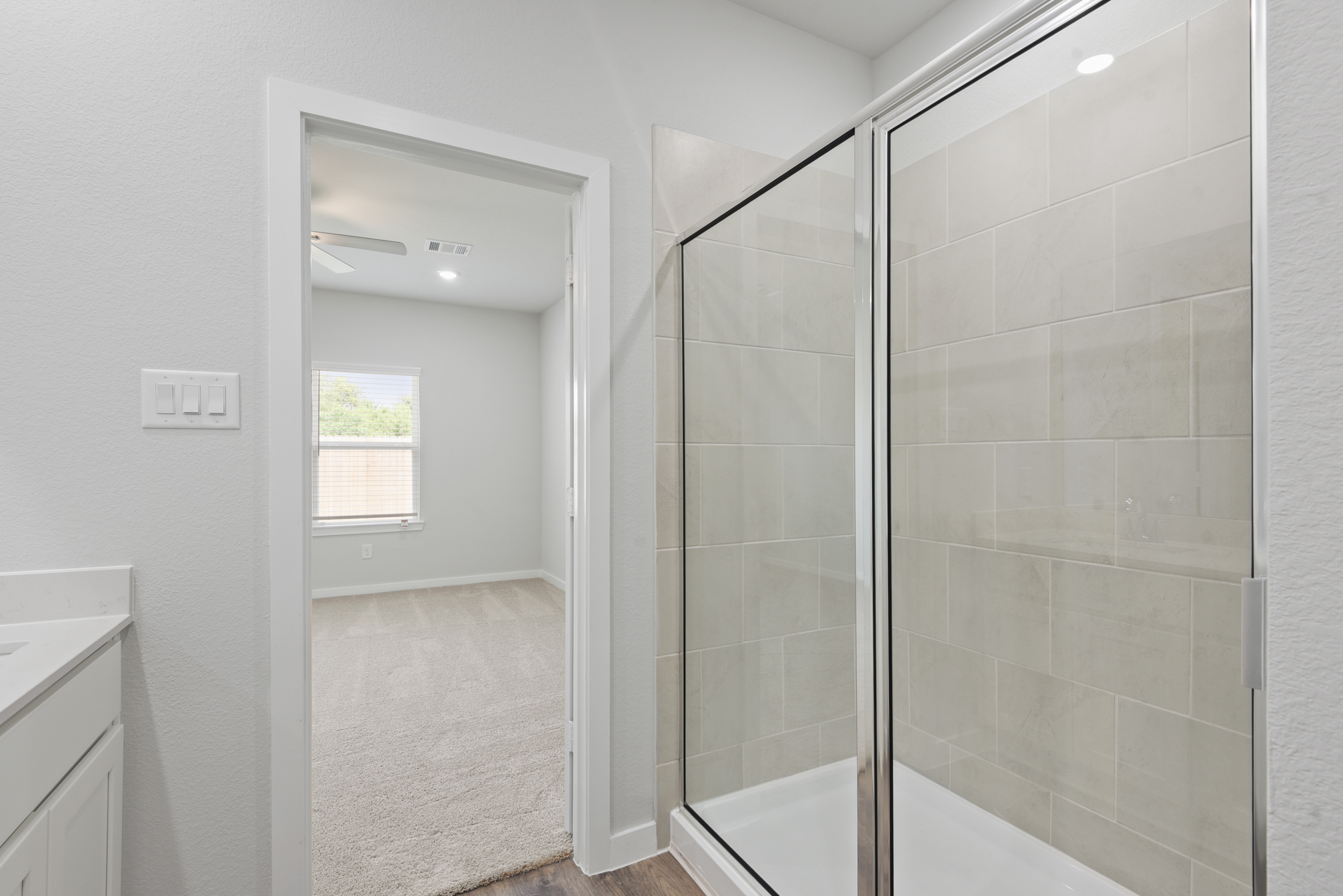 A bathroom with a glass shower.