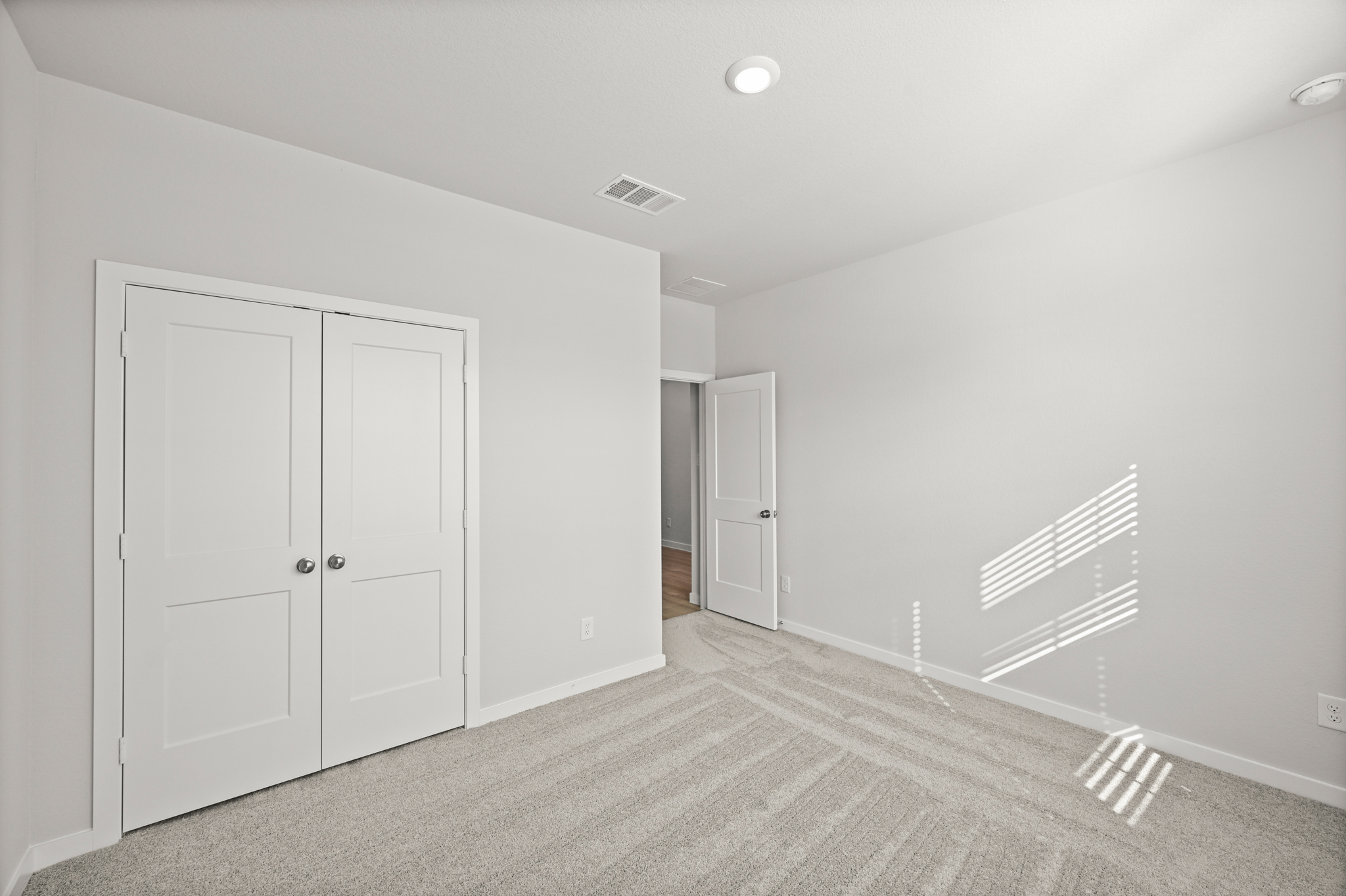A room with white doors.