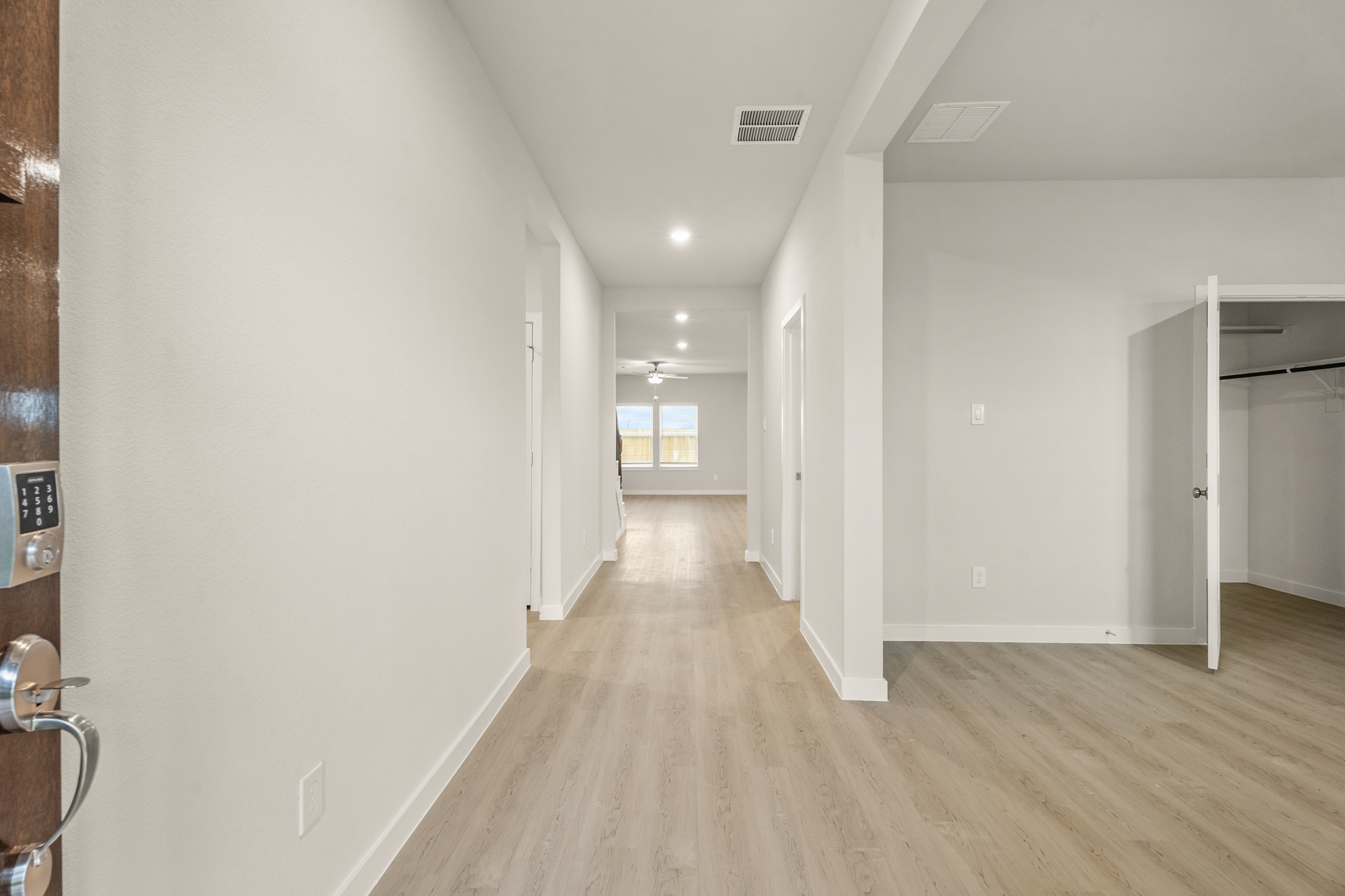 A hallway with white walls.