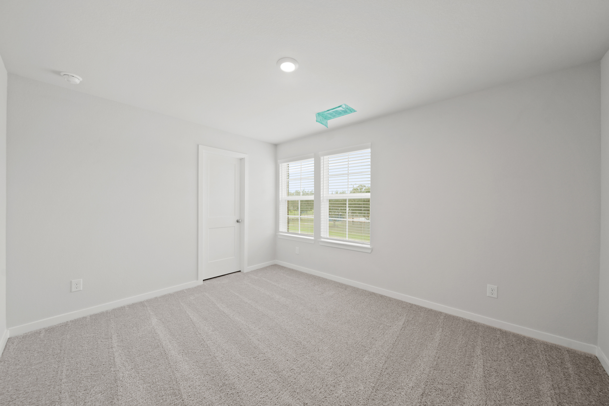 A room with a door and a window.