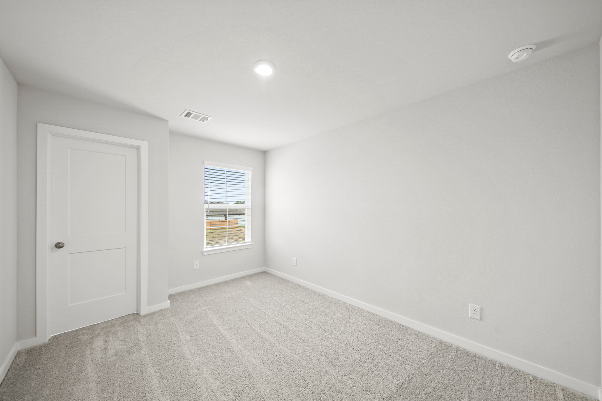 A room with a door and a window.