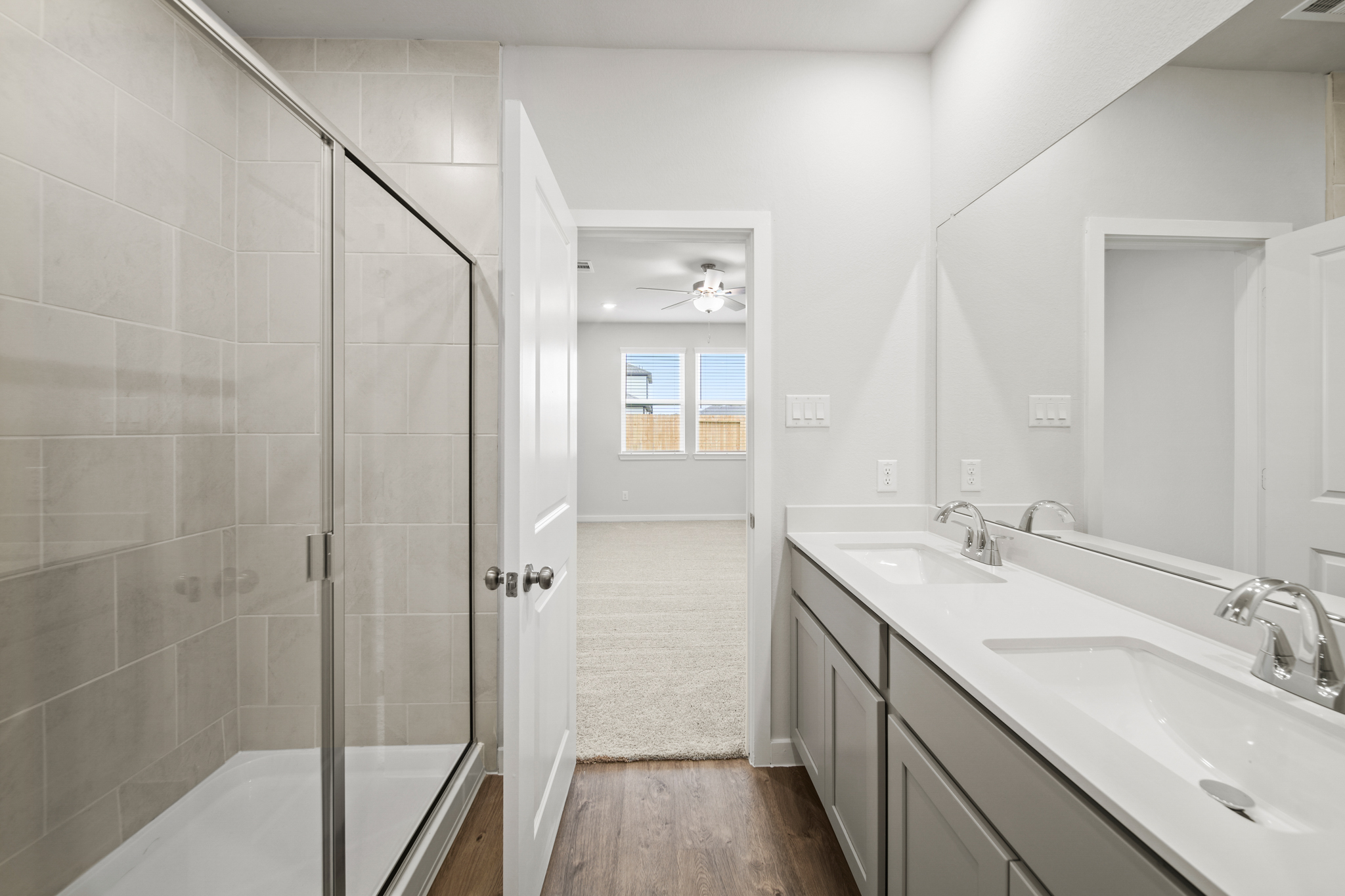 A bathroom with a glass shower.