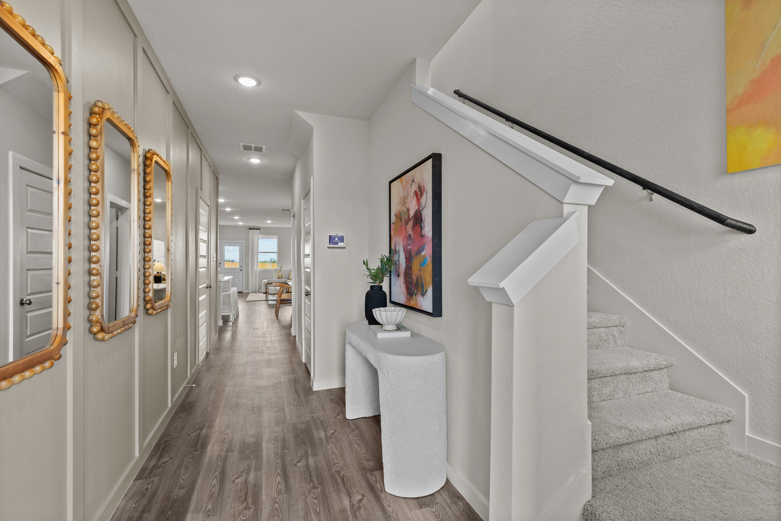 A hallway with white walls.