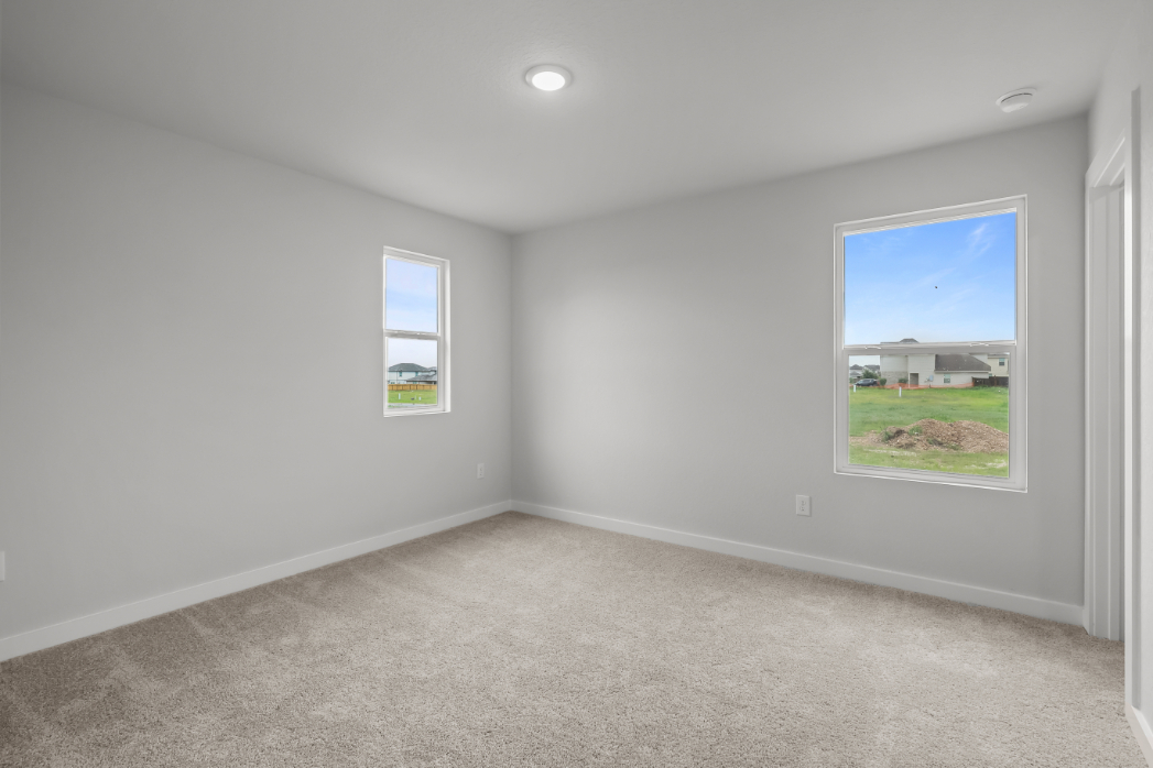 A room with a window and a door.