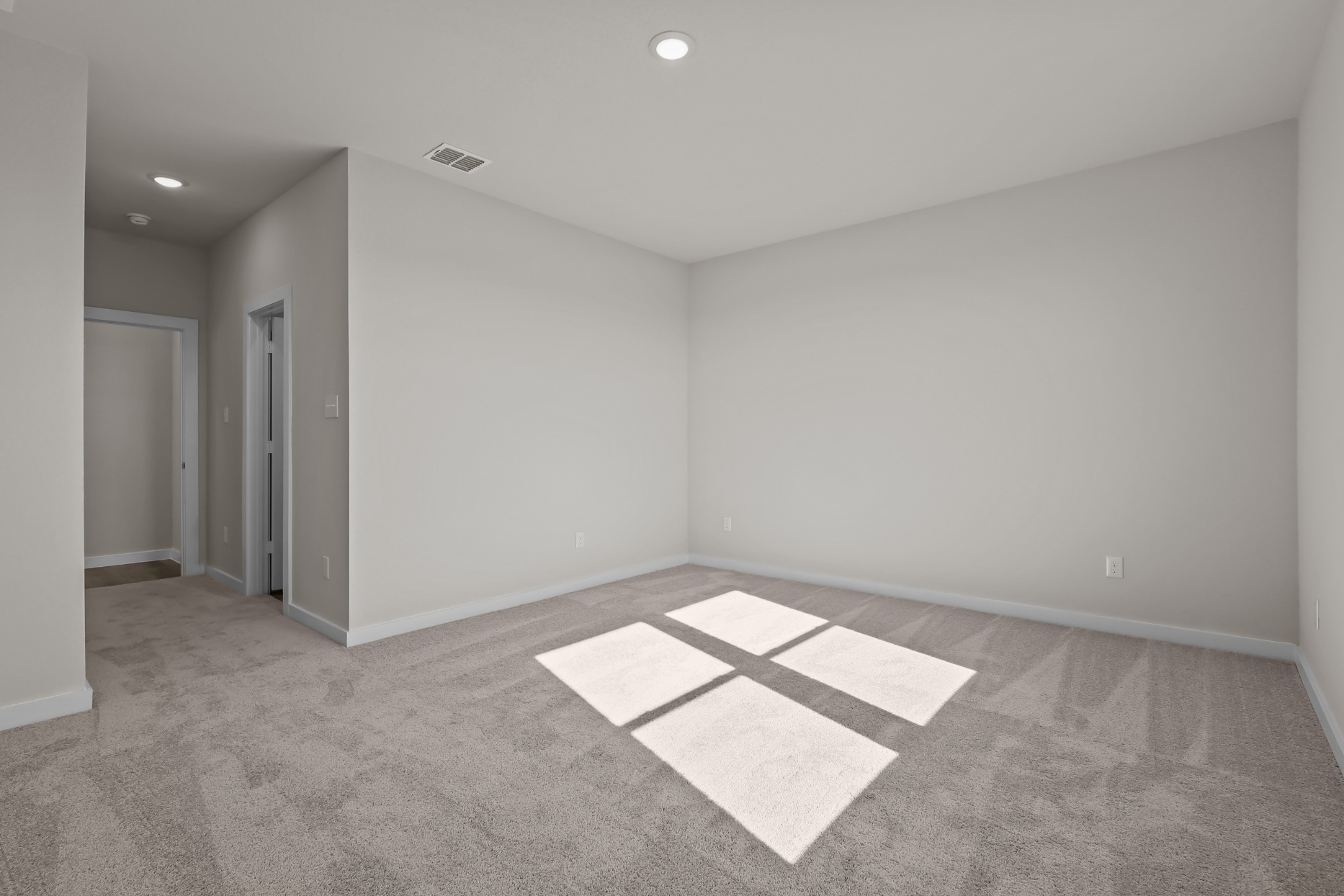 A room with a rug and a rug.