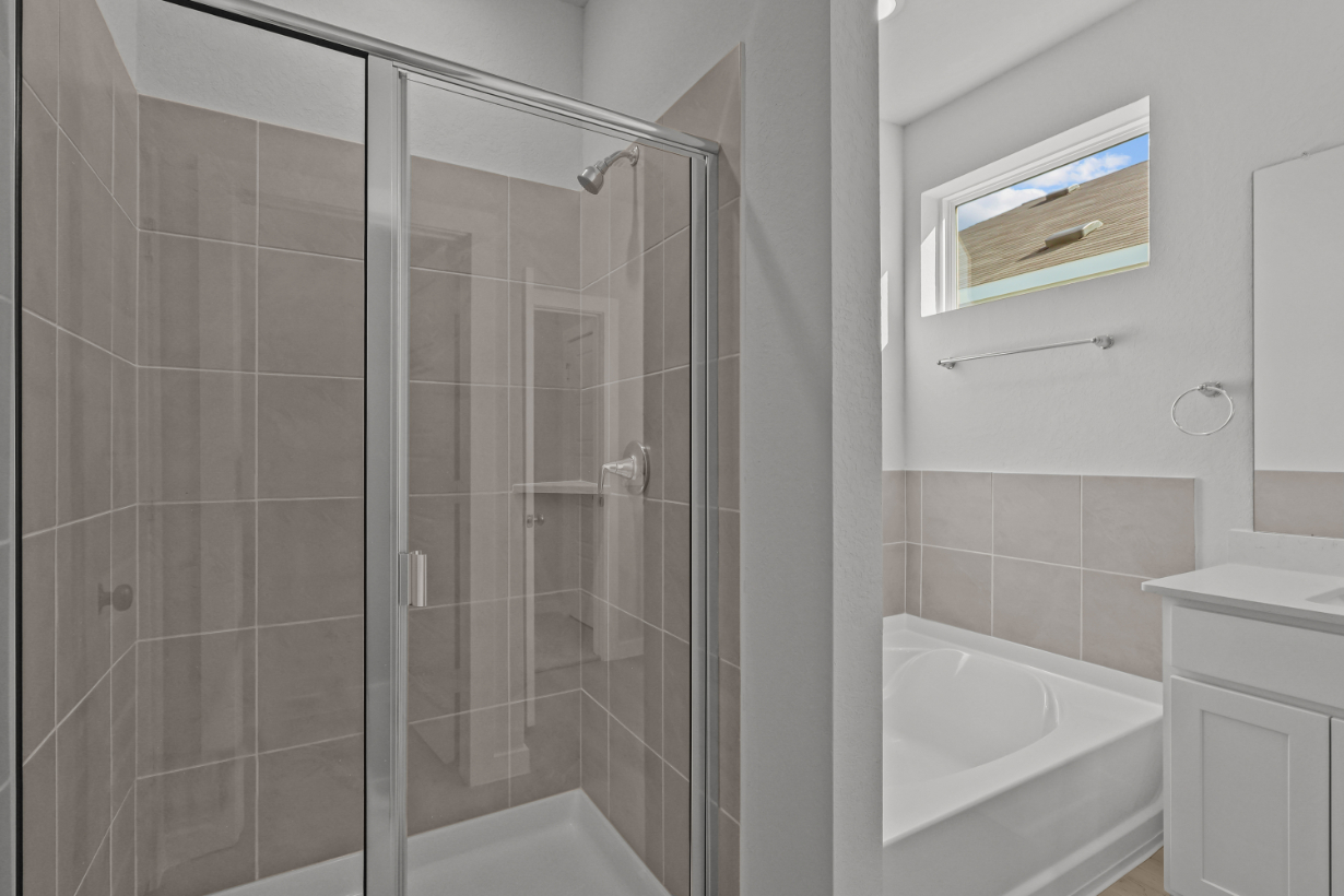 A bathroom with a glass shower.