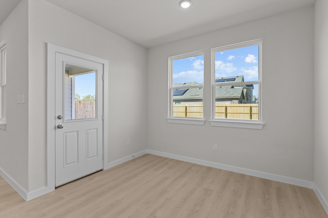 A room with a door and a window.