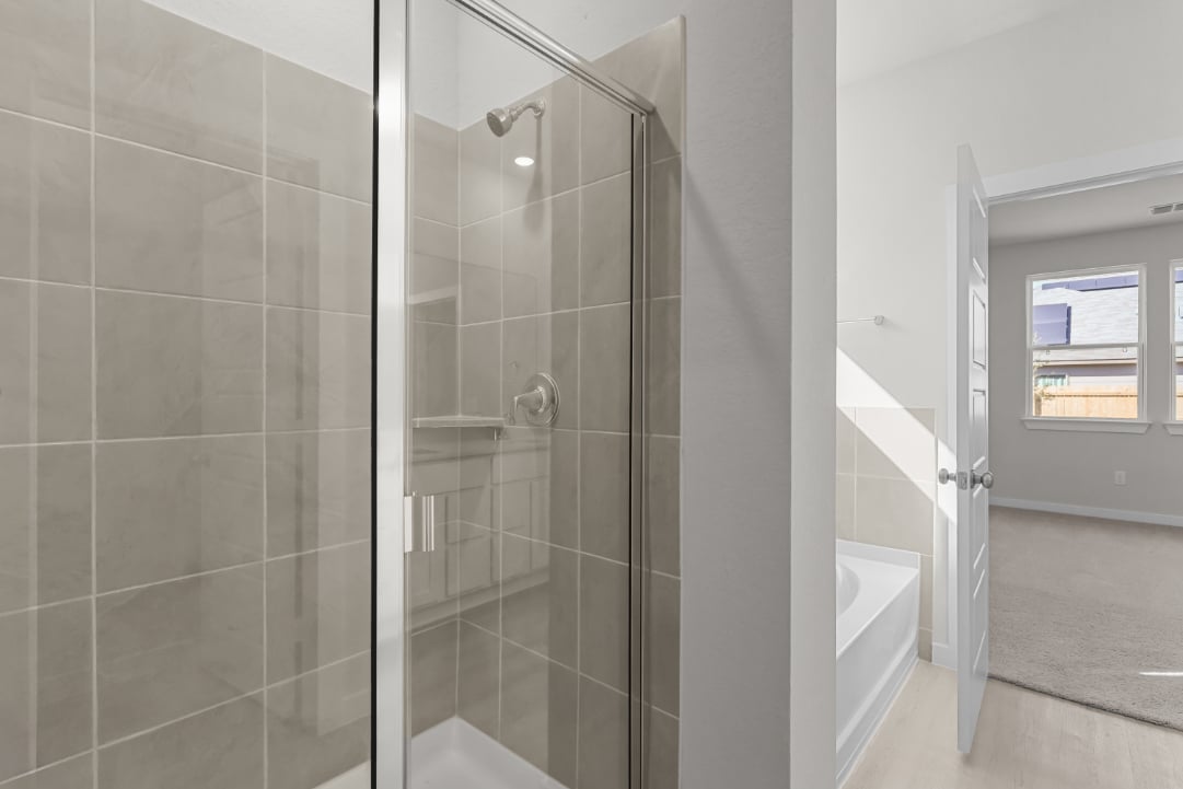 A shower with a glass door.