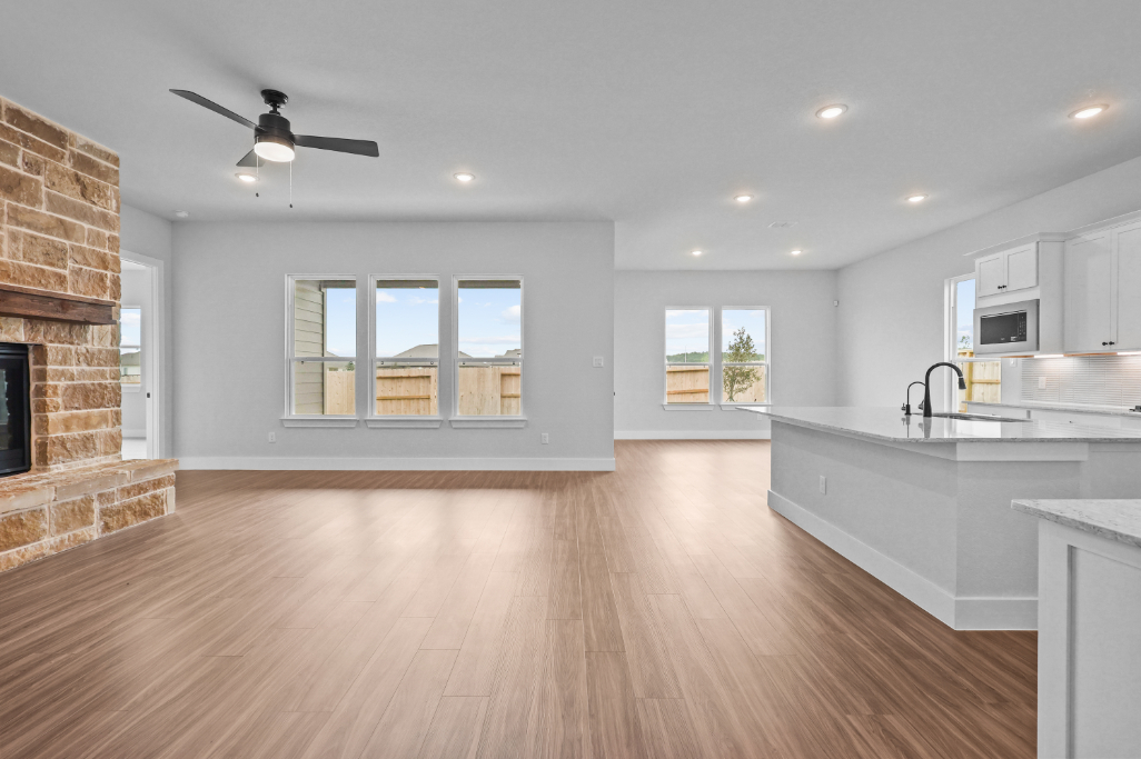 A kitchen with a wood floor.