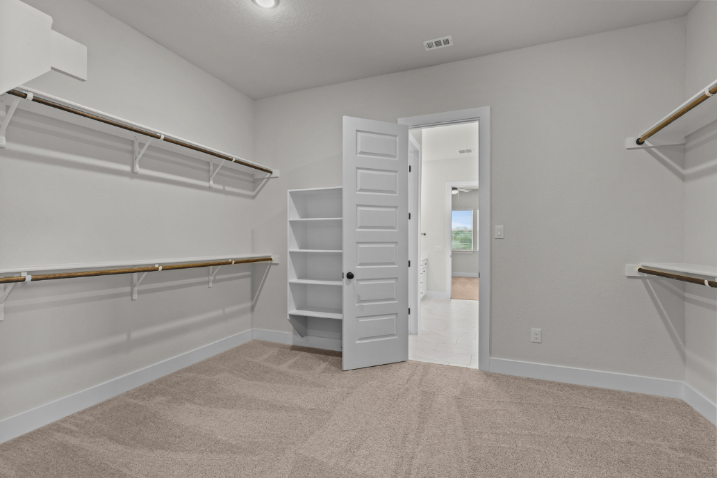 A white room with a white wall and a white cabinet.