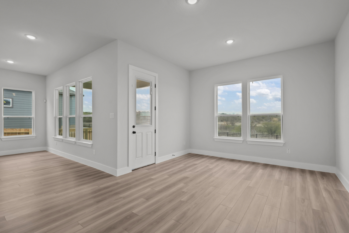 A room with white walls and windows.